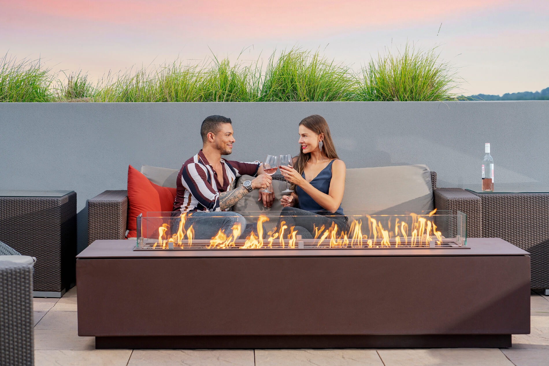 Couple sitting by fireplace