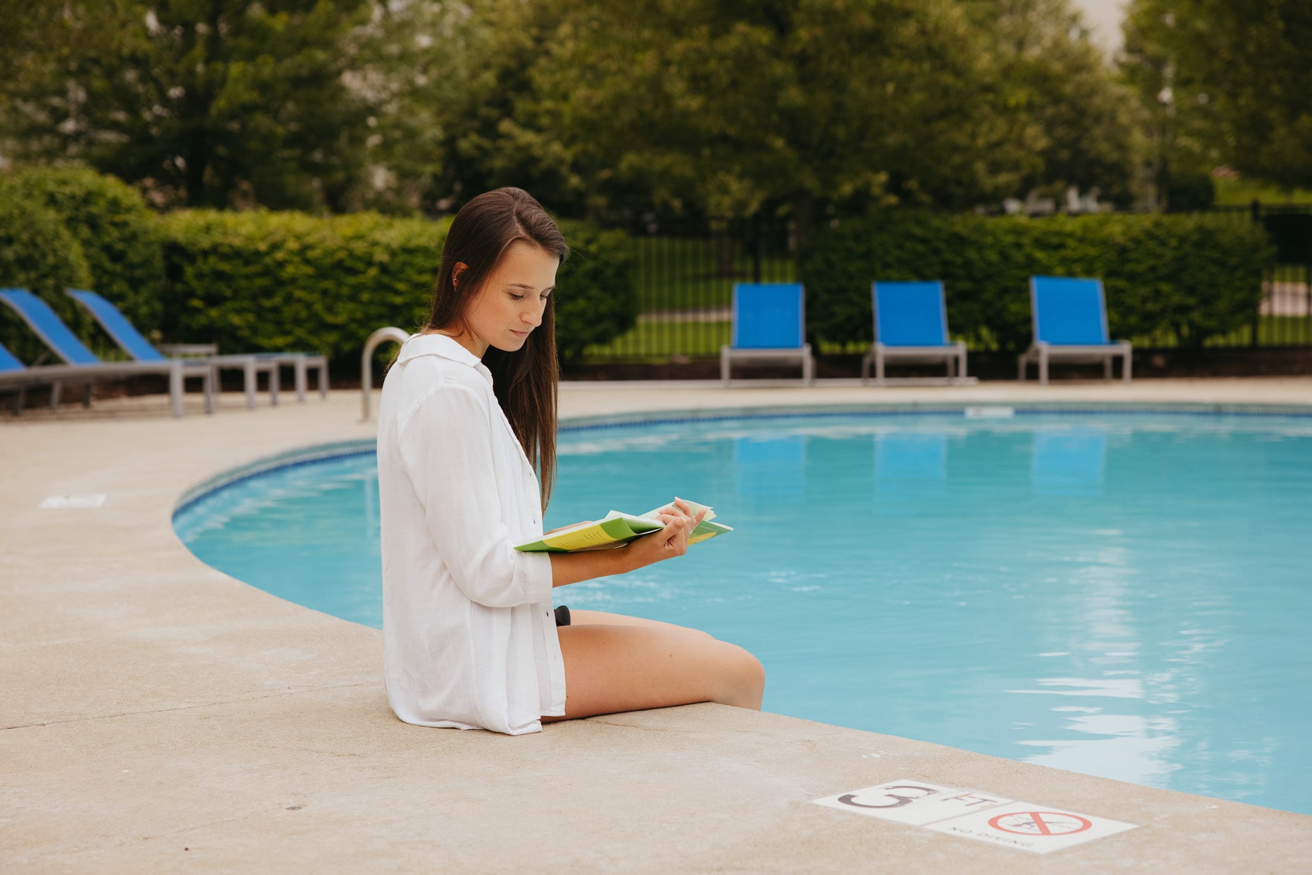 Union Place woman sits by pool reading