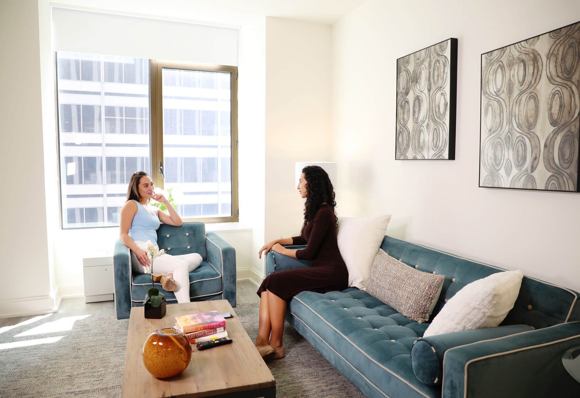 Friends talking in the living room