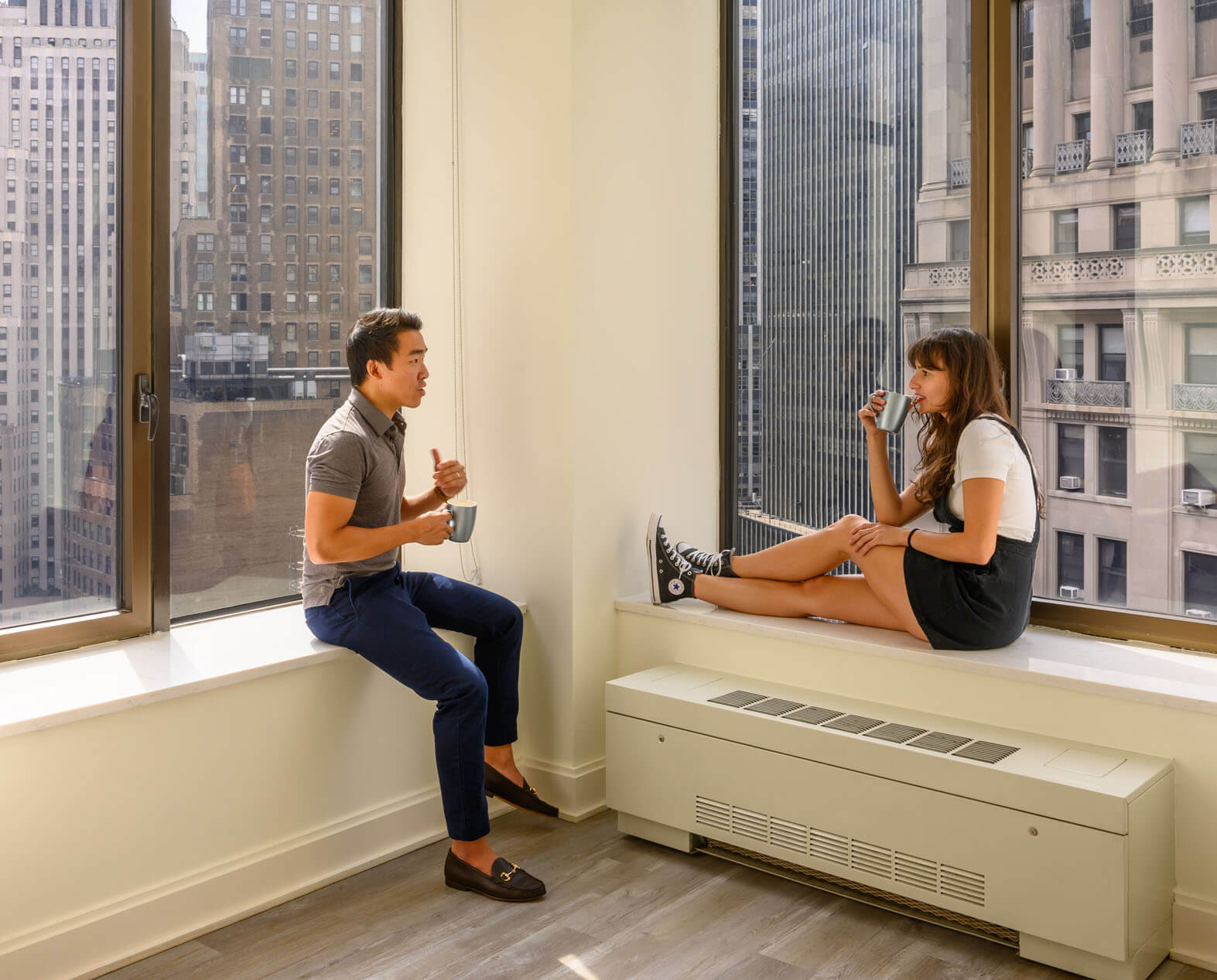 Couple sitting in apartment living room