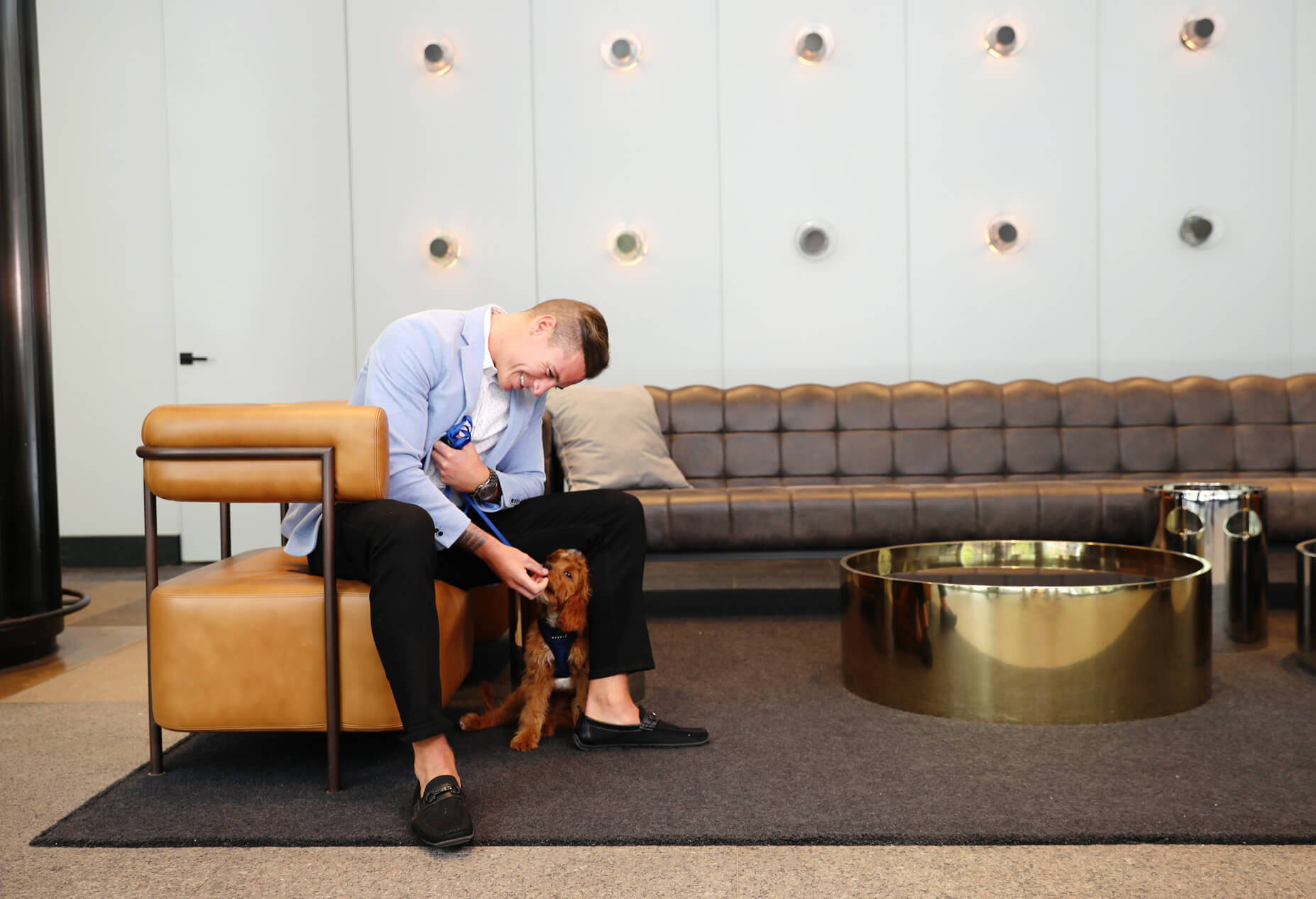 Man with his dog in the 10 Hanover lobby
