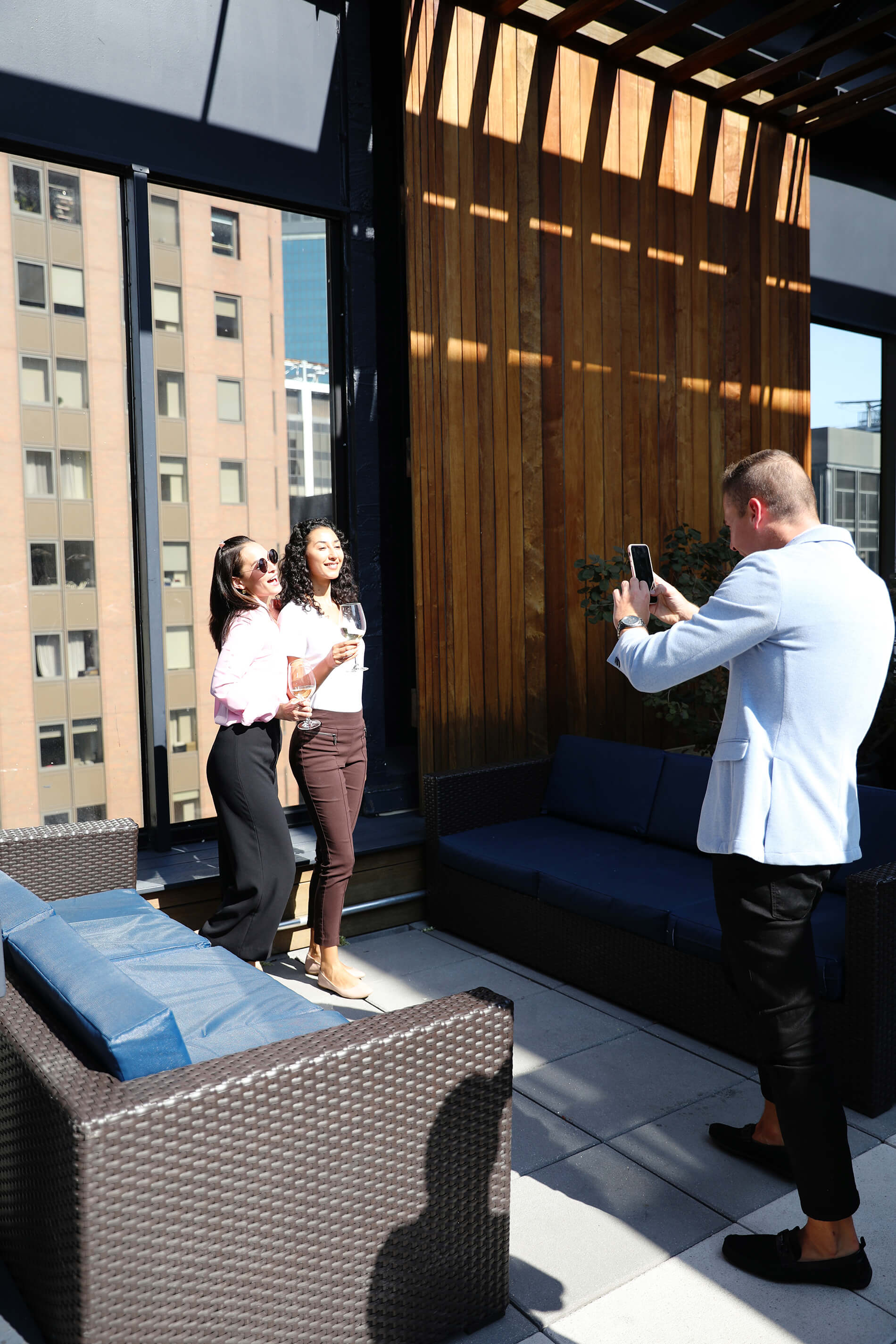 Friends taking pictures on the 10 Hanover rooftop