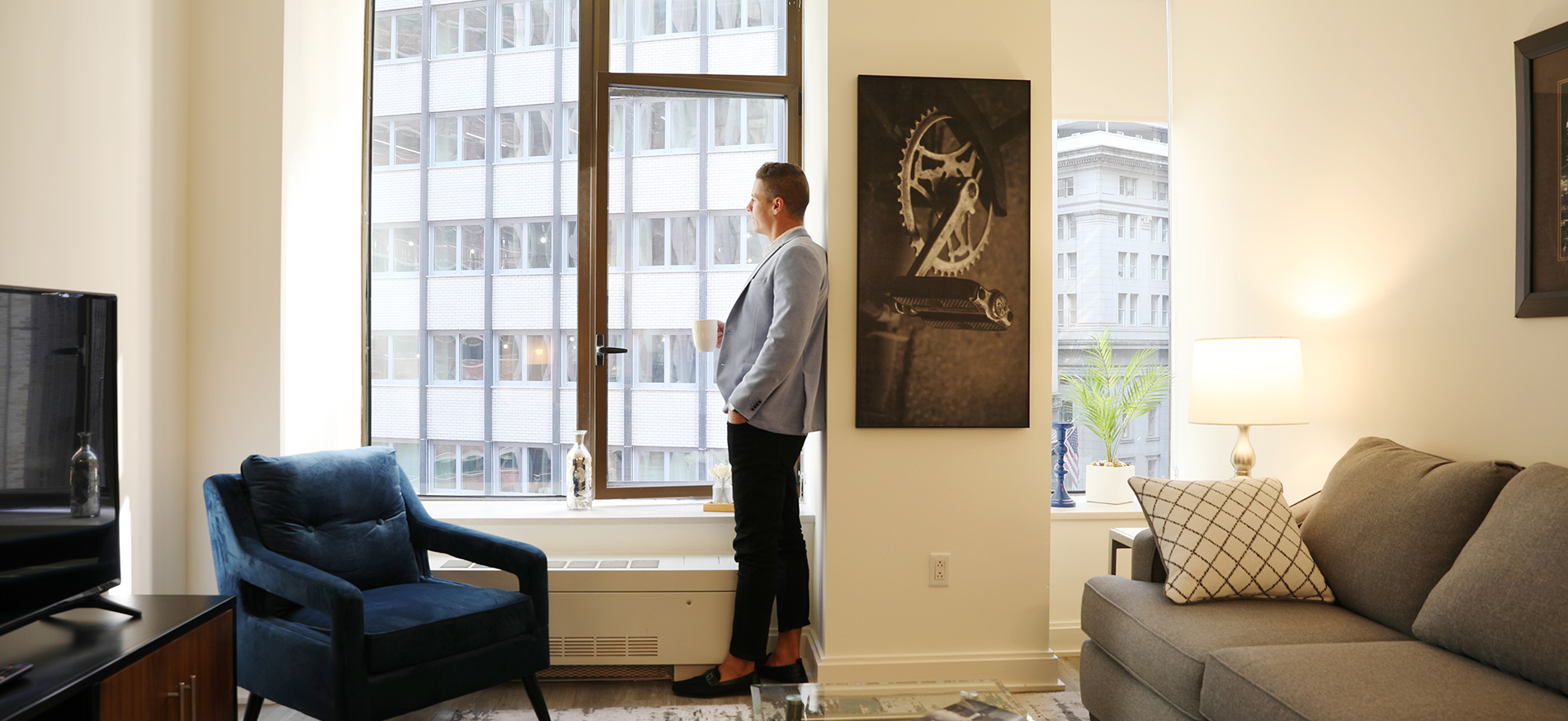 Man standing in his 10 Hanover Square living room