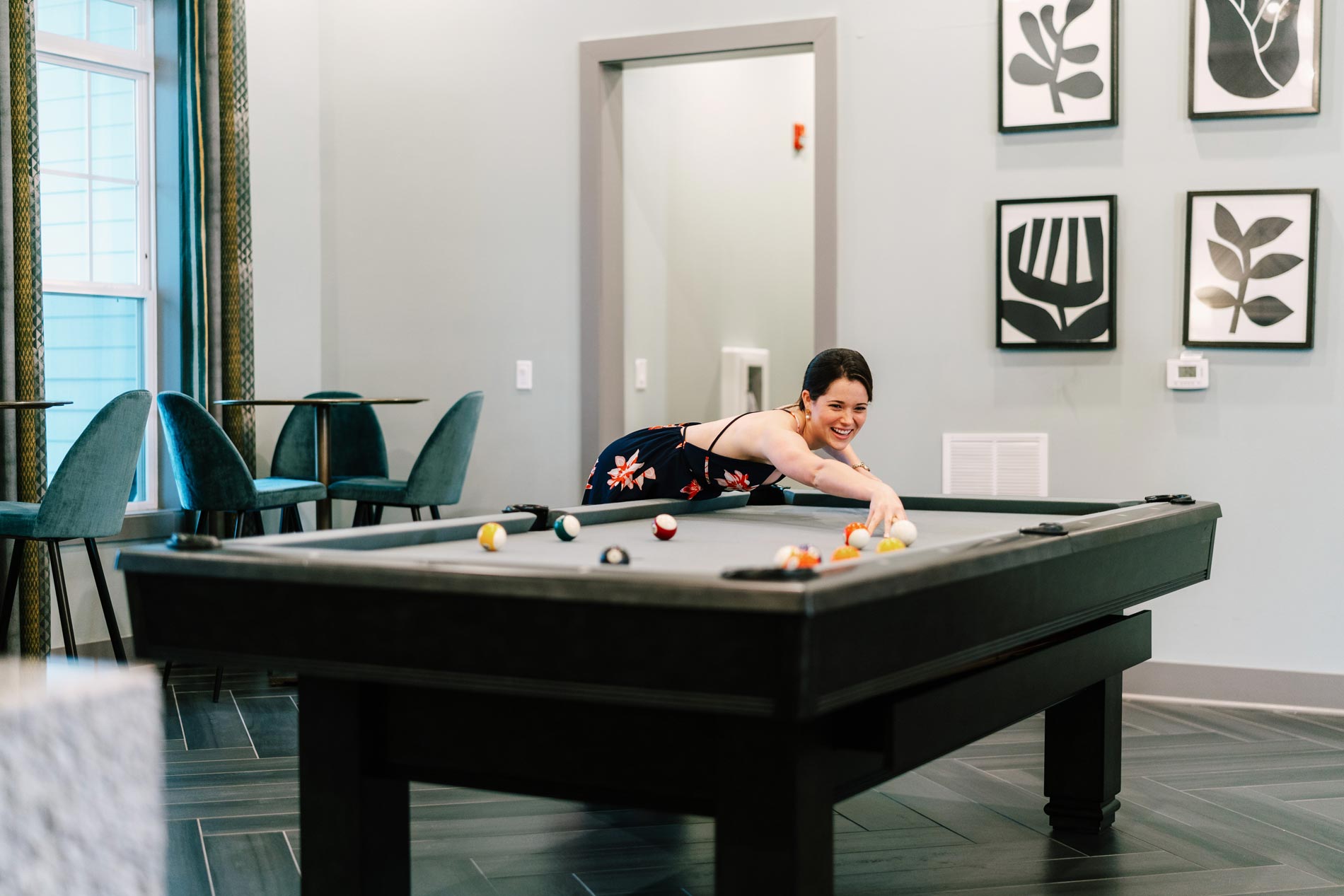 1274 At Towson Apartments Woman Playing Pool