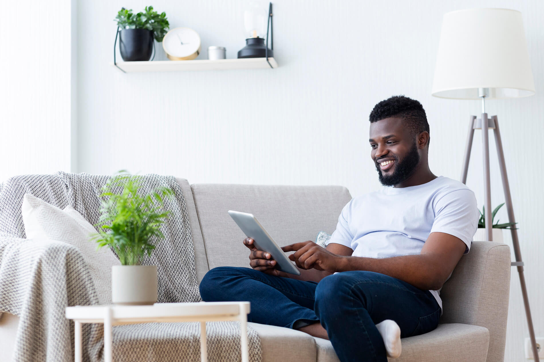 Man using a computer on the couch