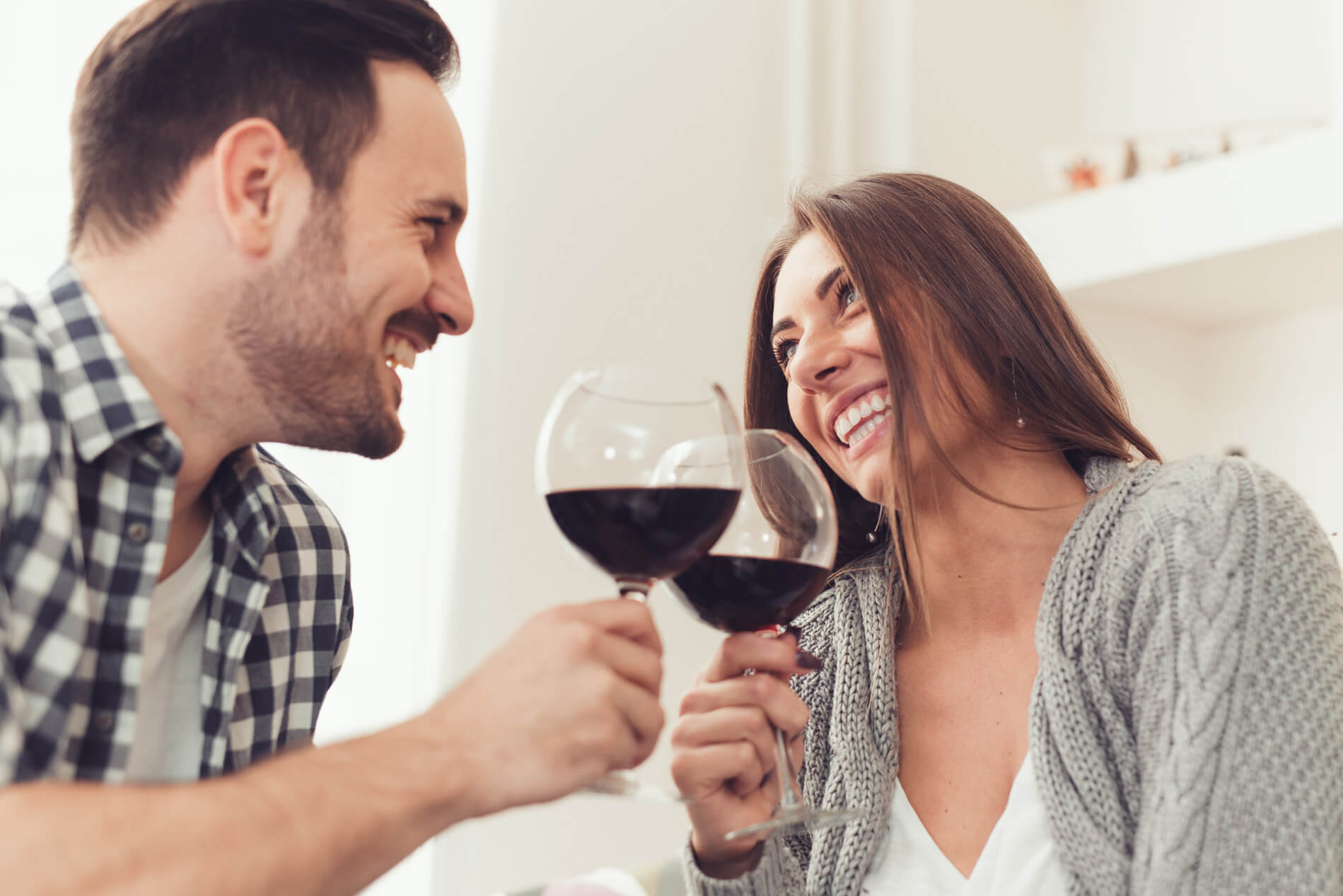 Couple drinking wine at home