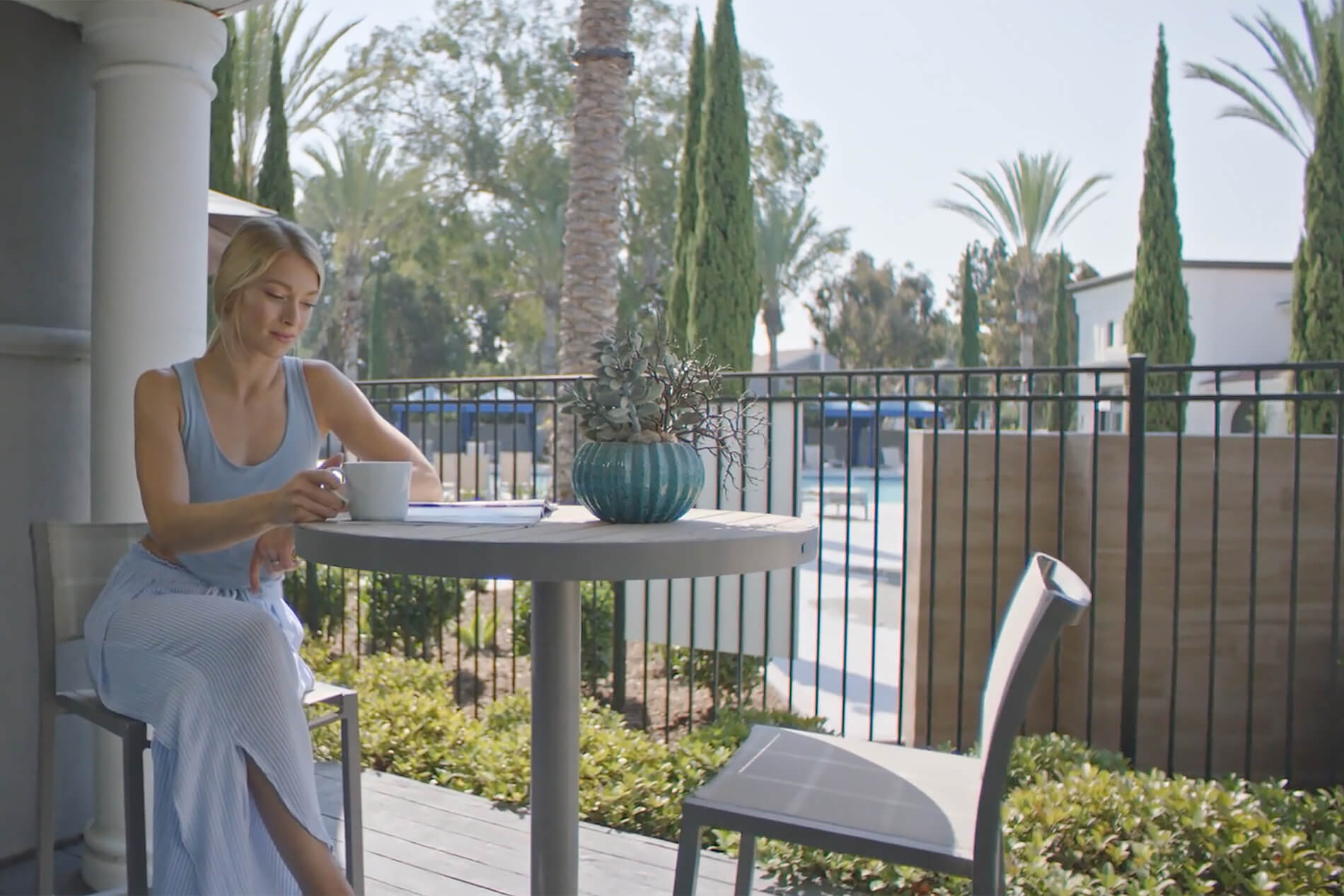 27 Seventy Five Apartments Woman on Patio