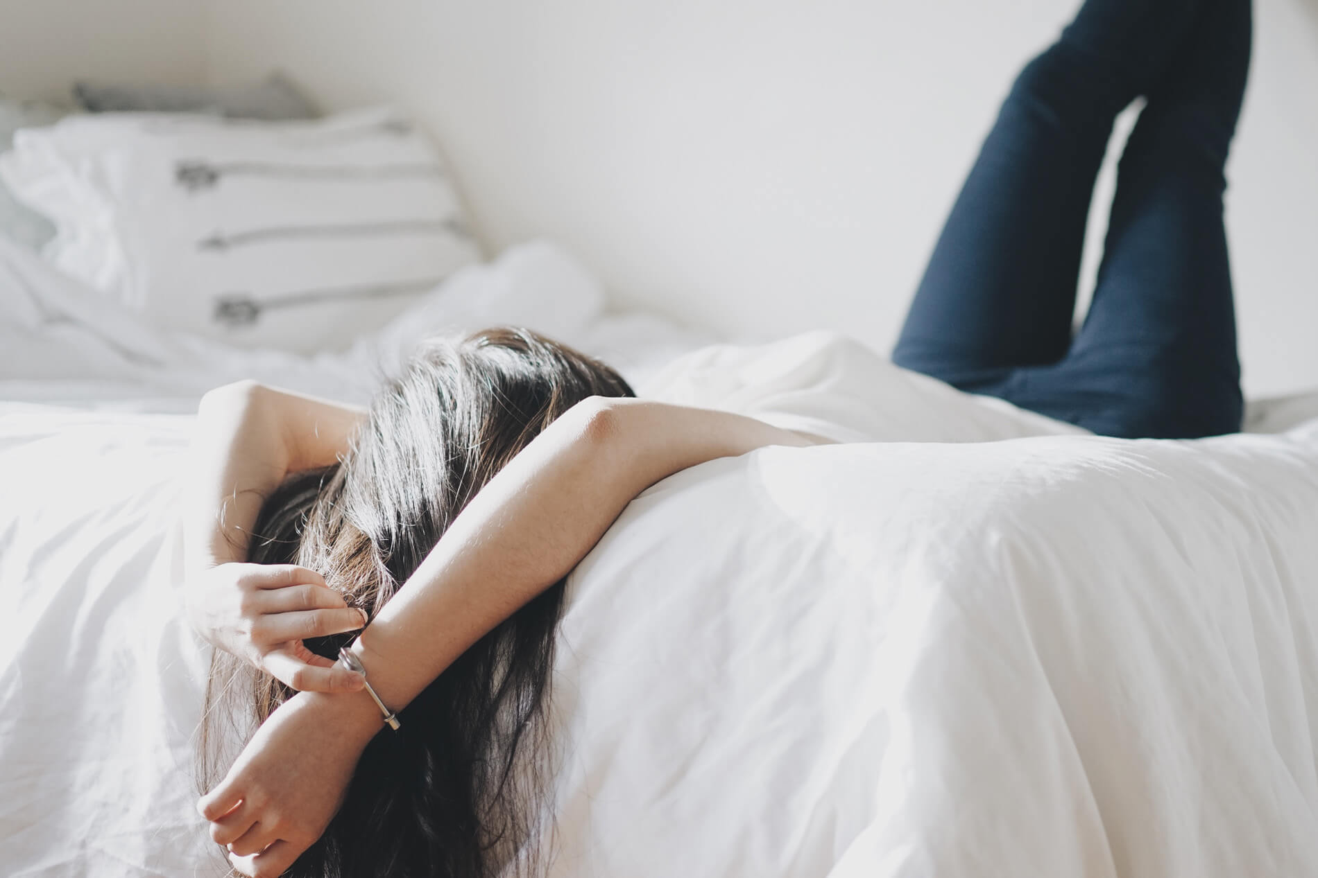 Woman laying on her bed