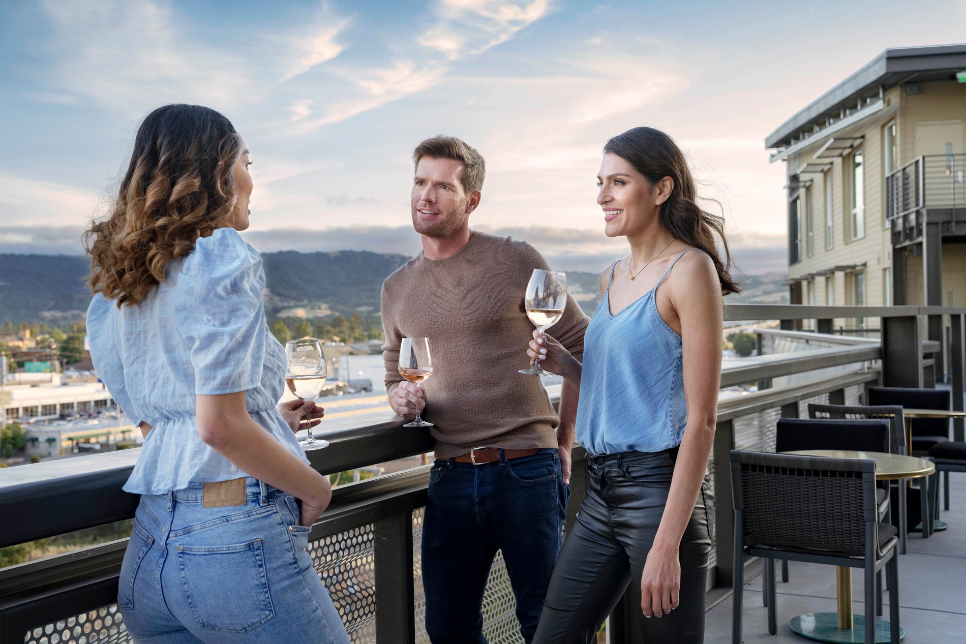 5421 Dublin station three people drink wine on the sky deck