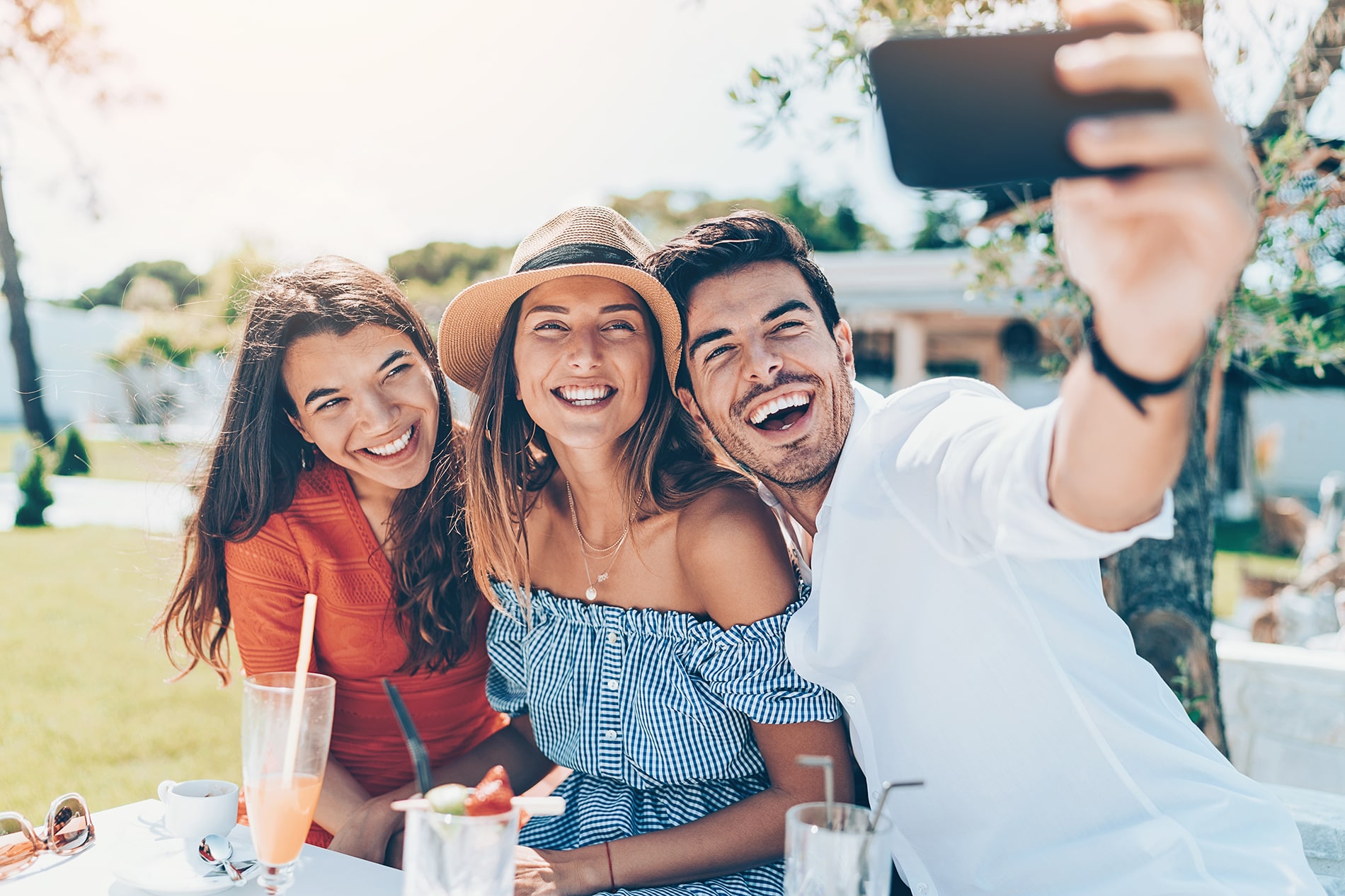 happy friends taking selfie
