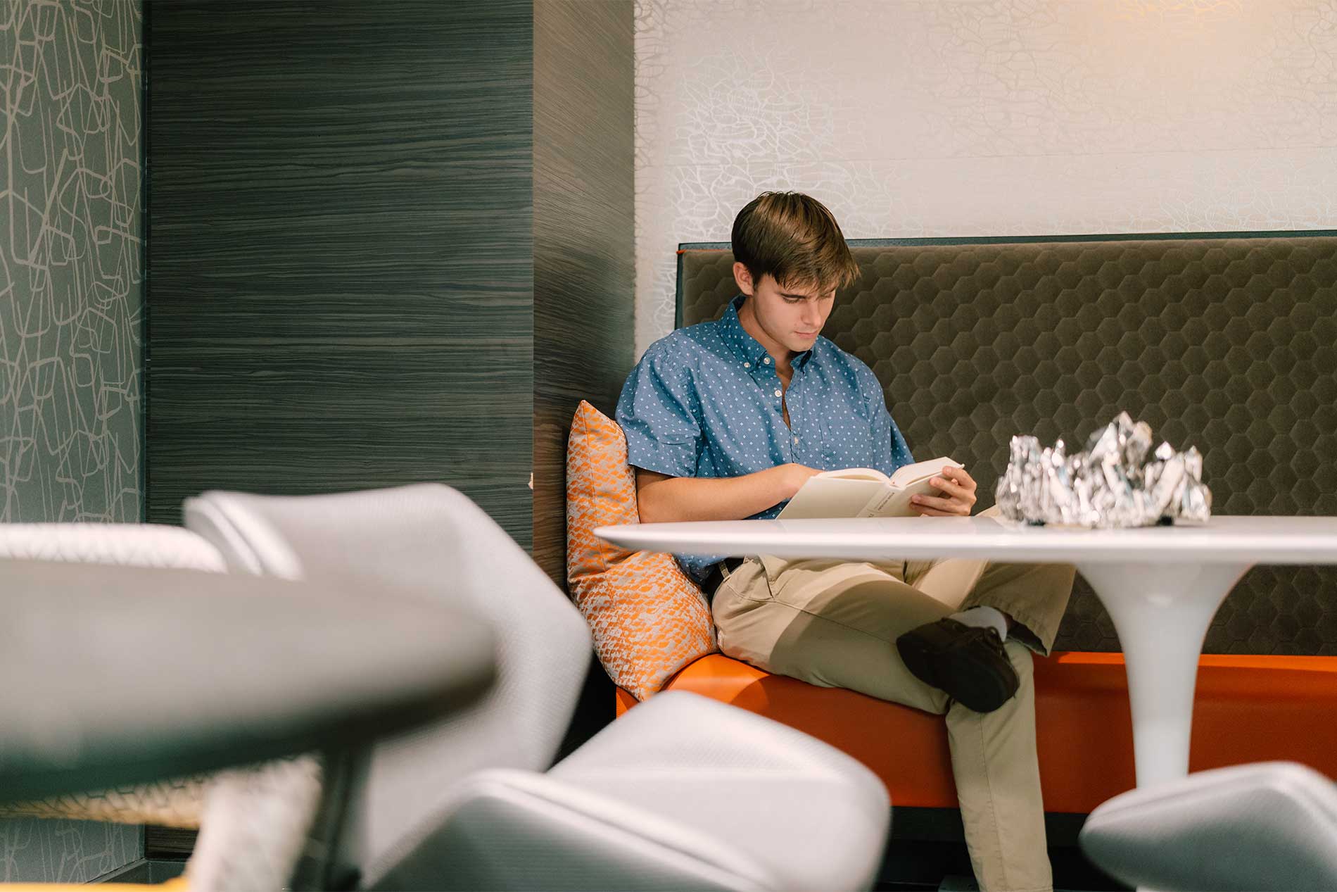 Man studying quietly in coworking lounge