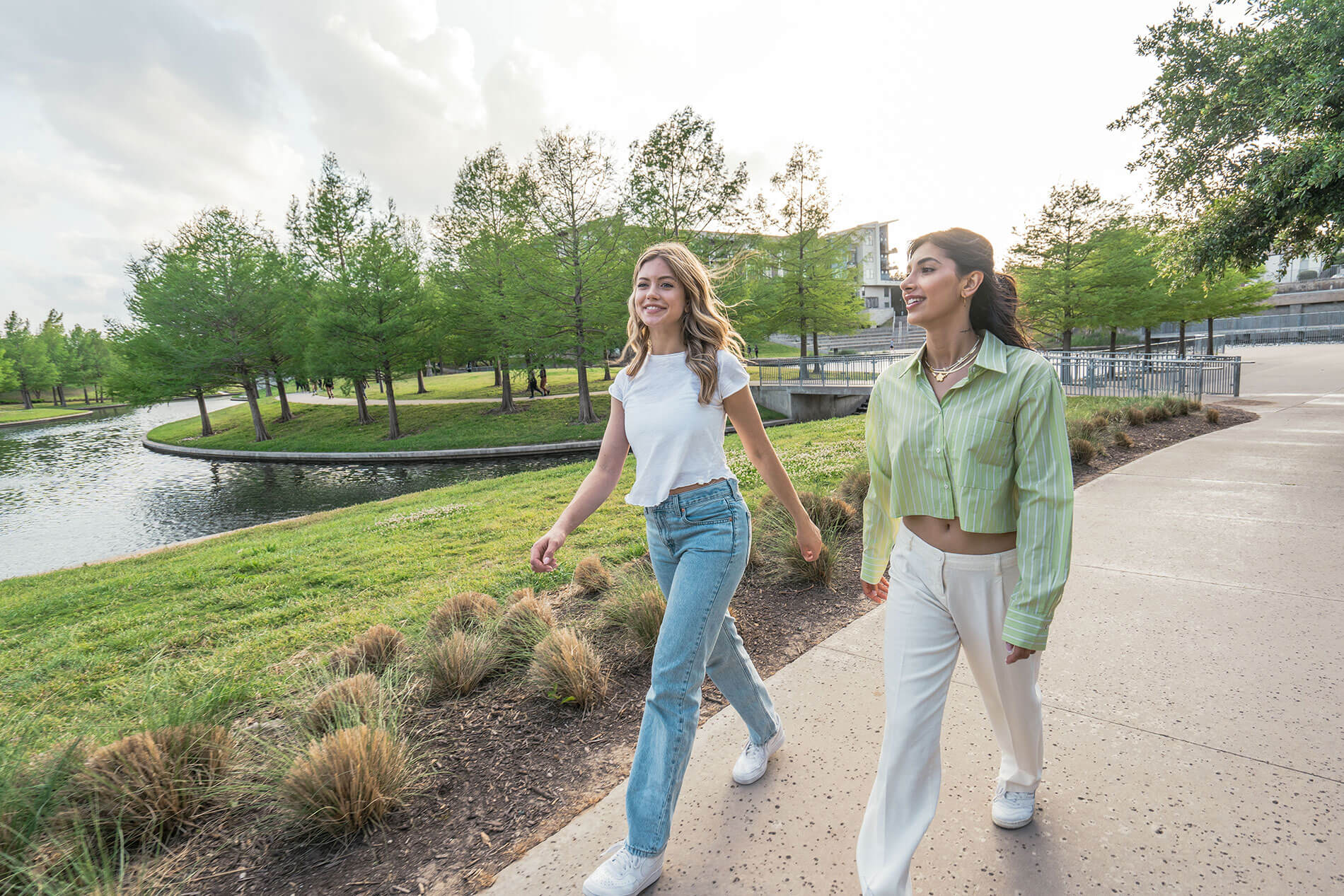 Two women walking in Vitruvian Park