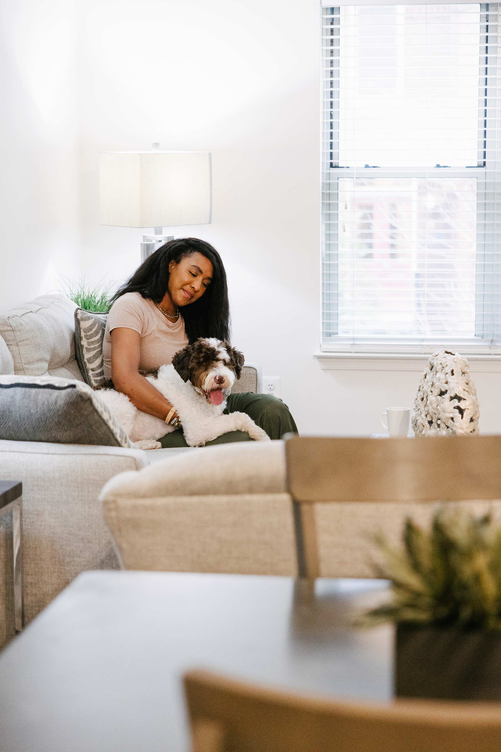 Andover House woman and dog on couch