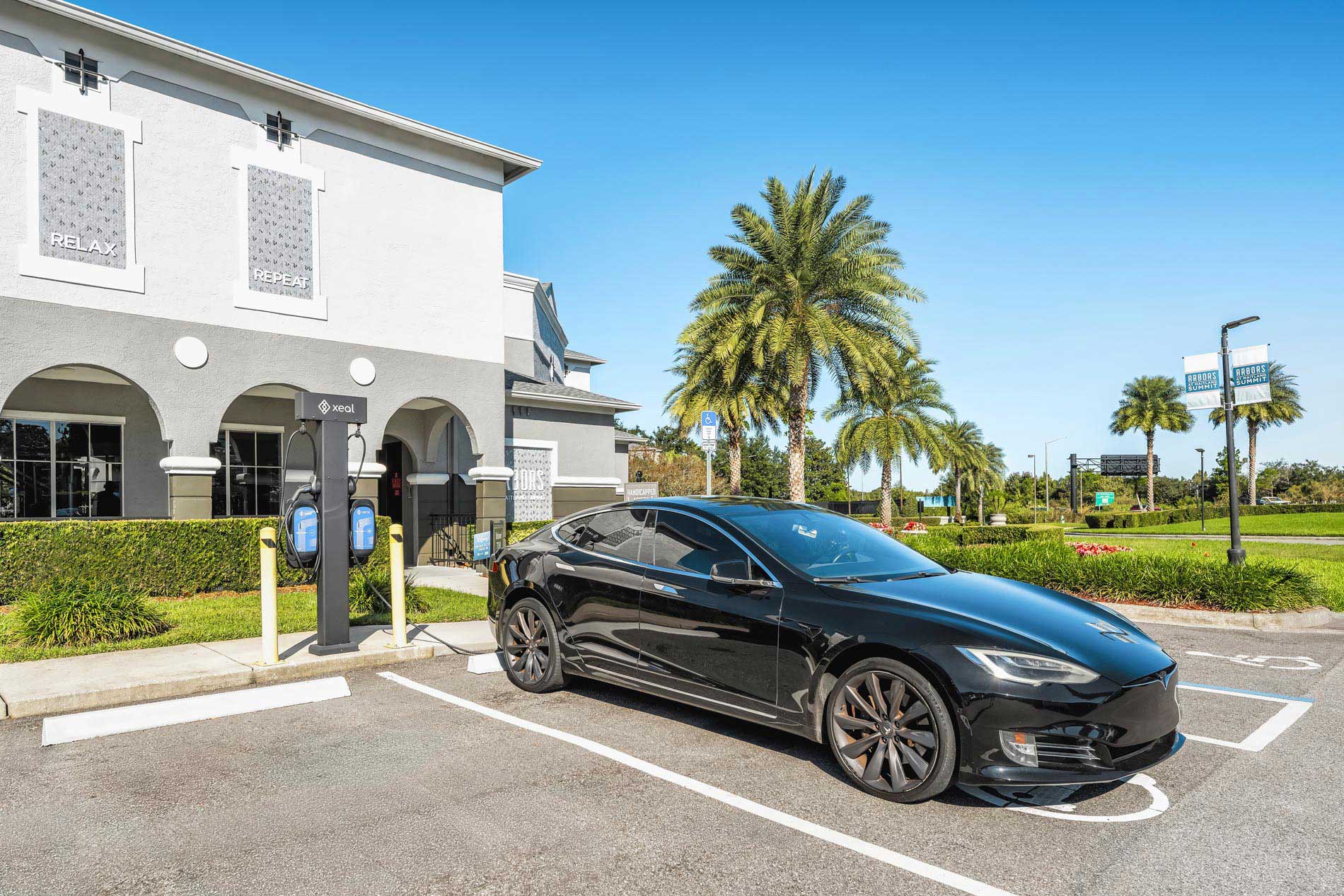 Arbors at Maitland EV charging station with Tesla