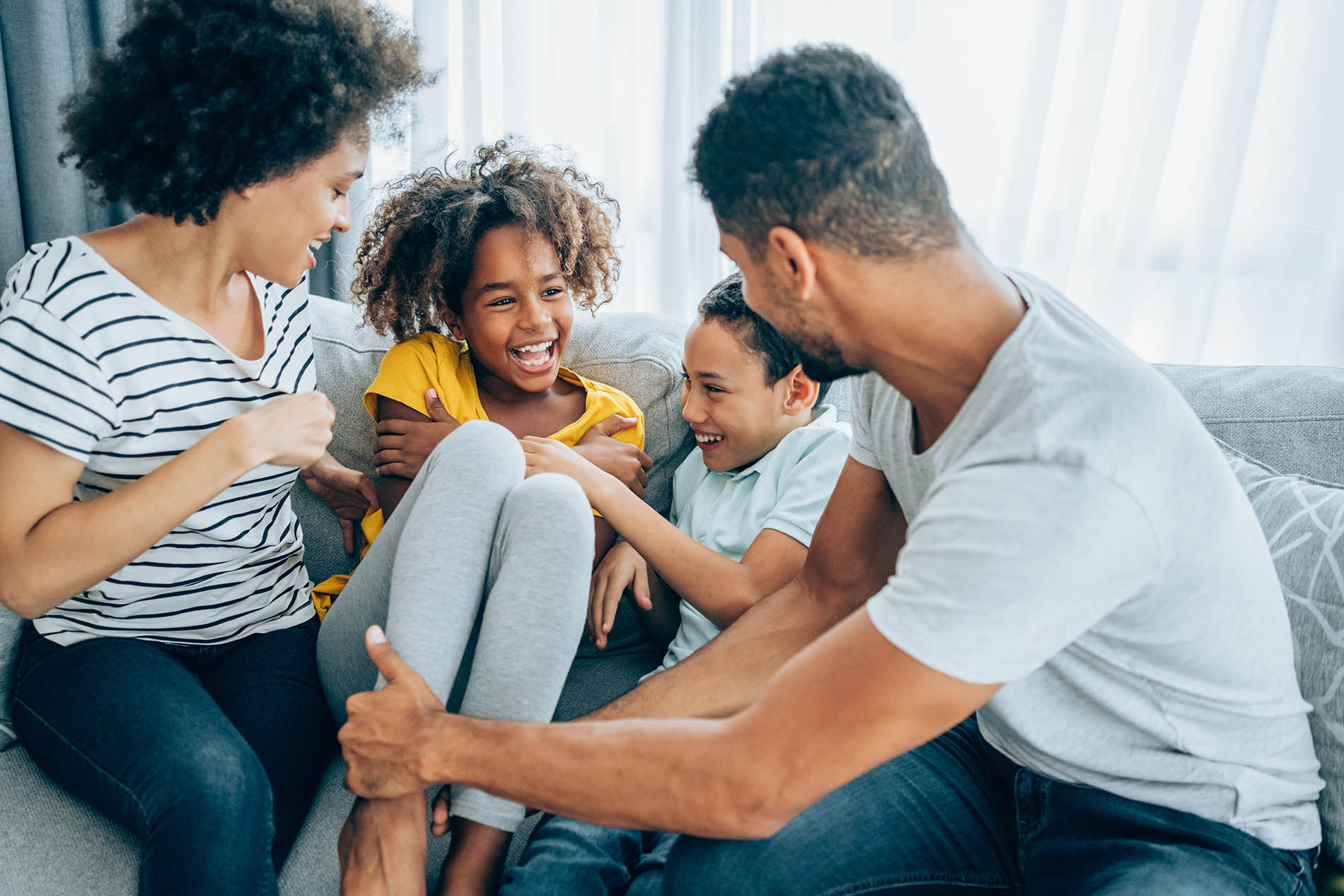 family hanging out on couch