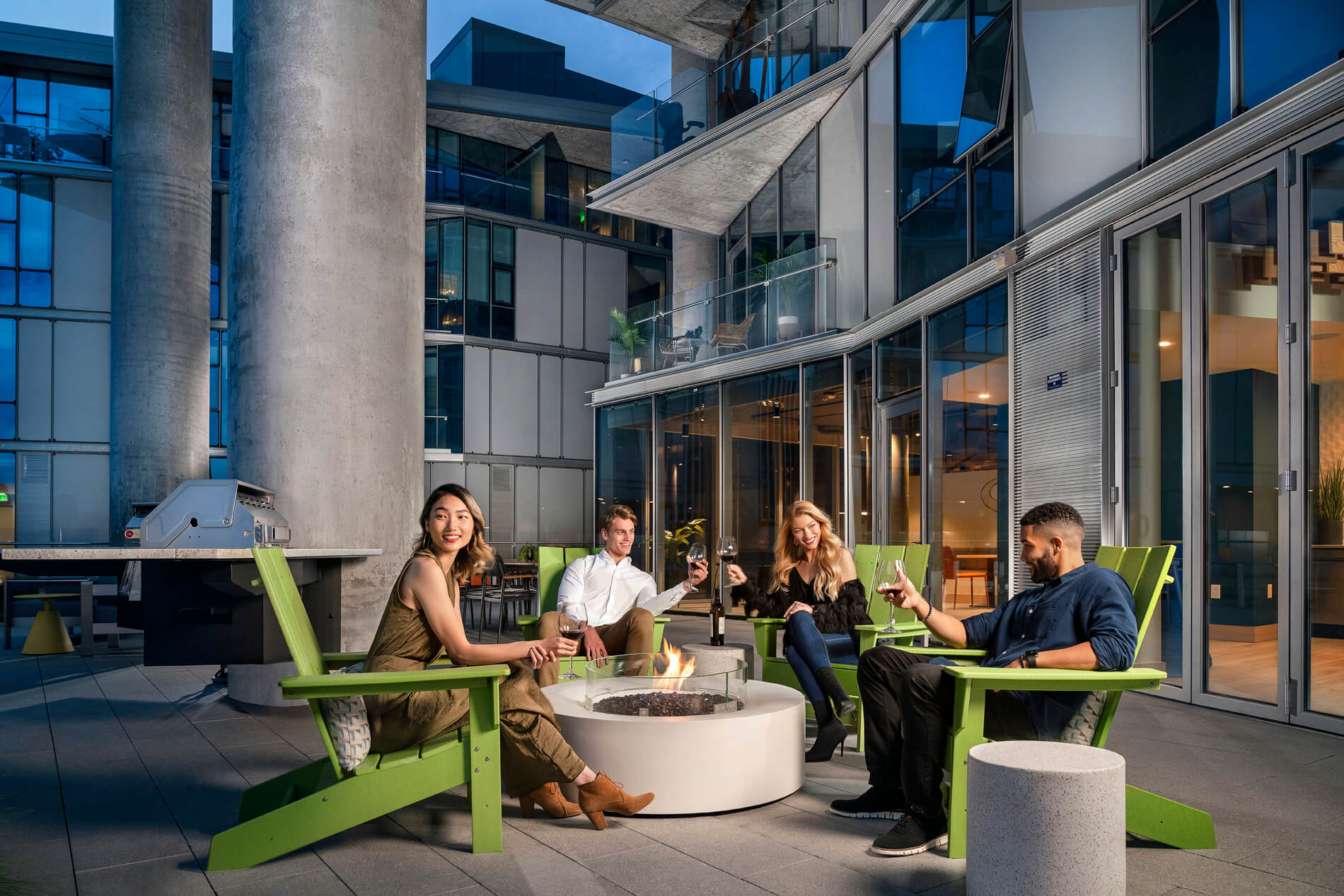 Friends by the fire pit on Brio deck