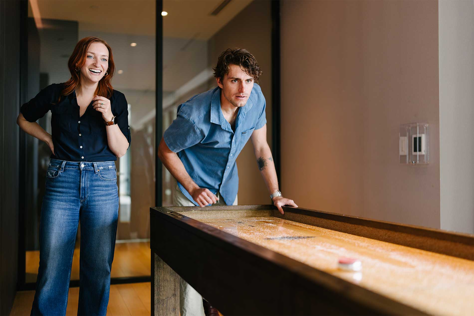 Friends playing shuffleboard