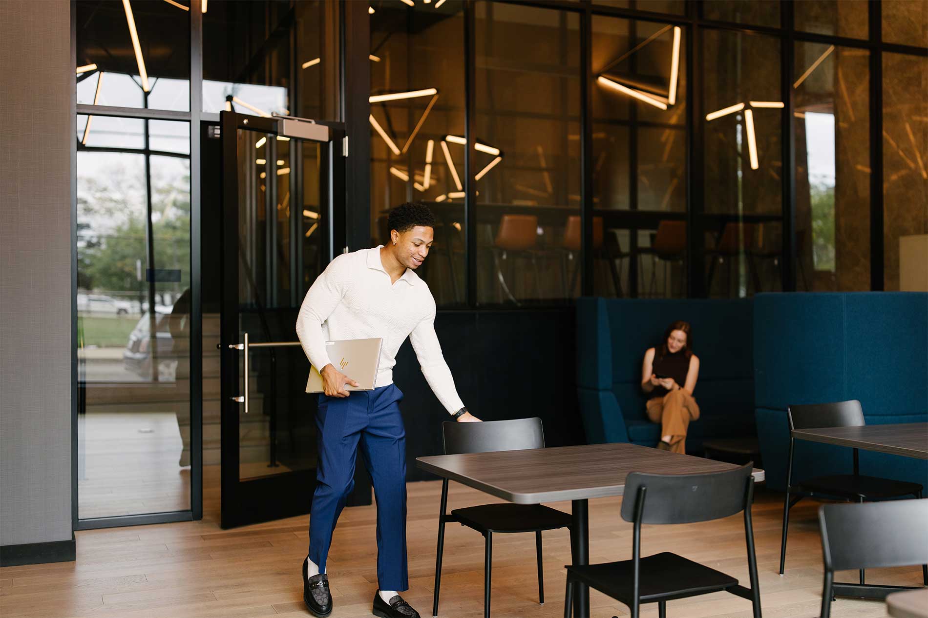 Young man sitting in coworking lounge