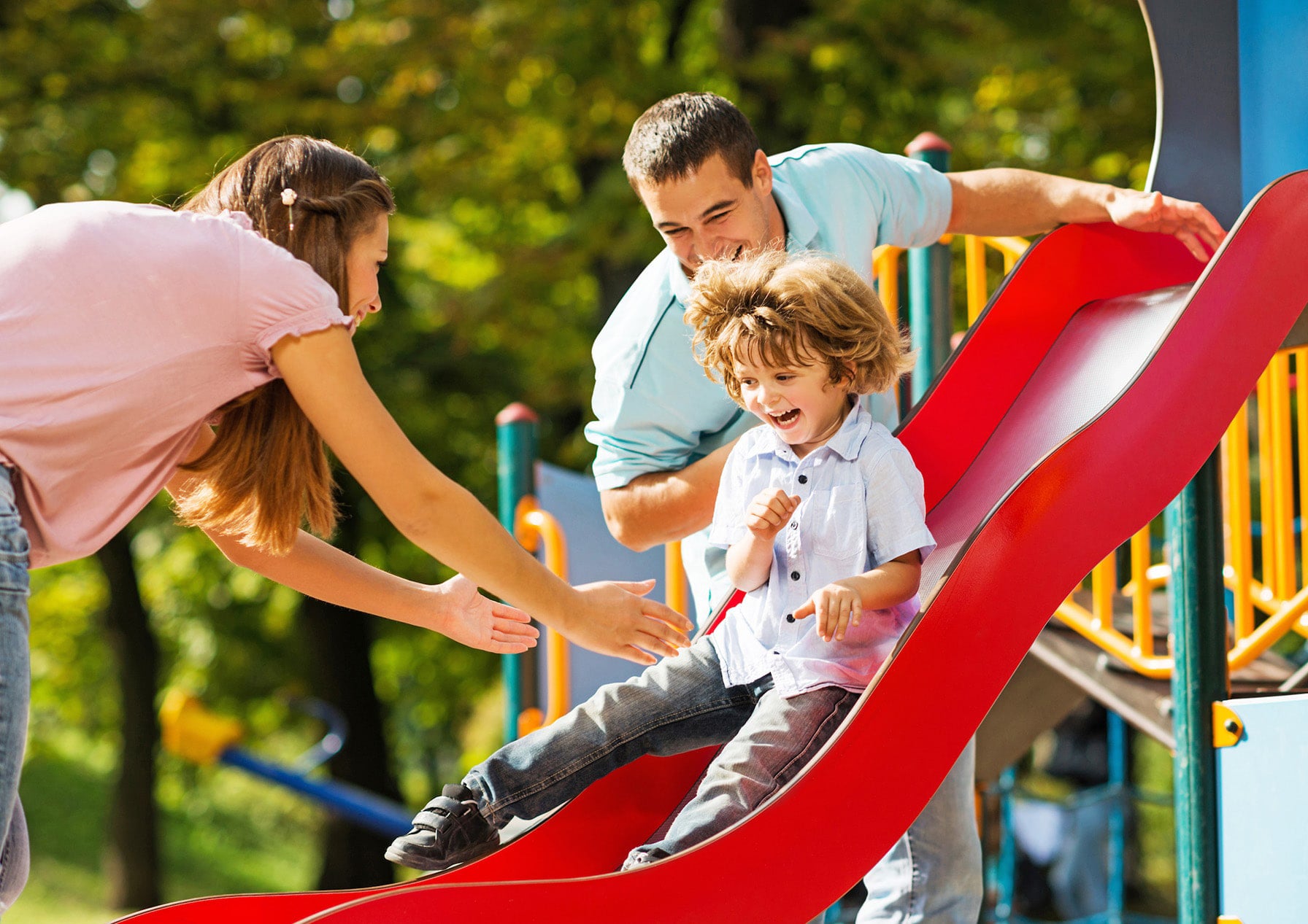 family playing on playground