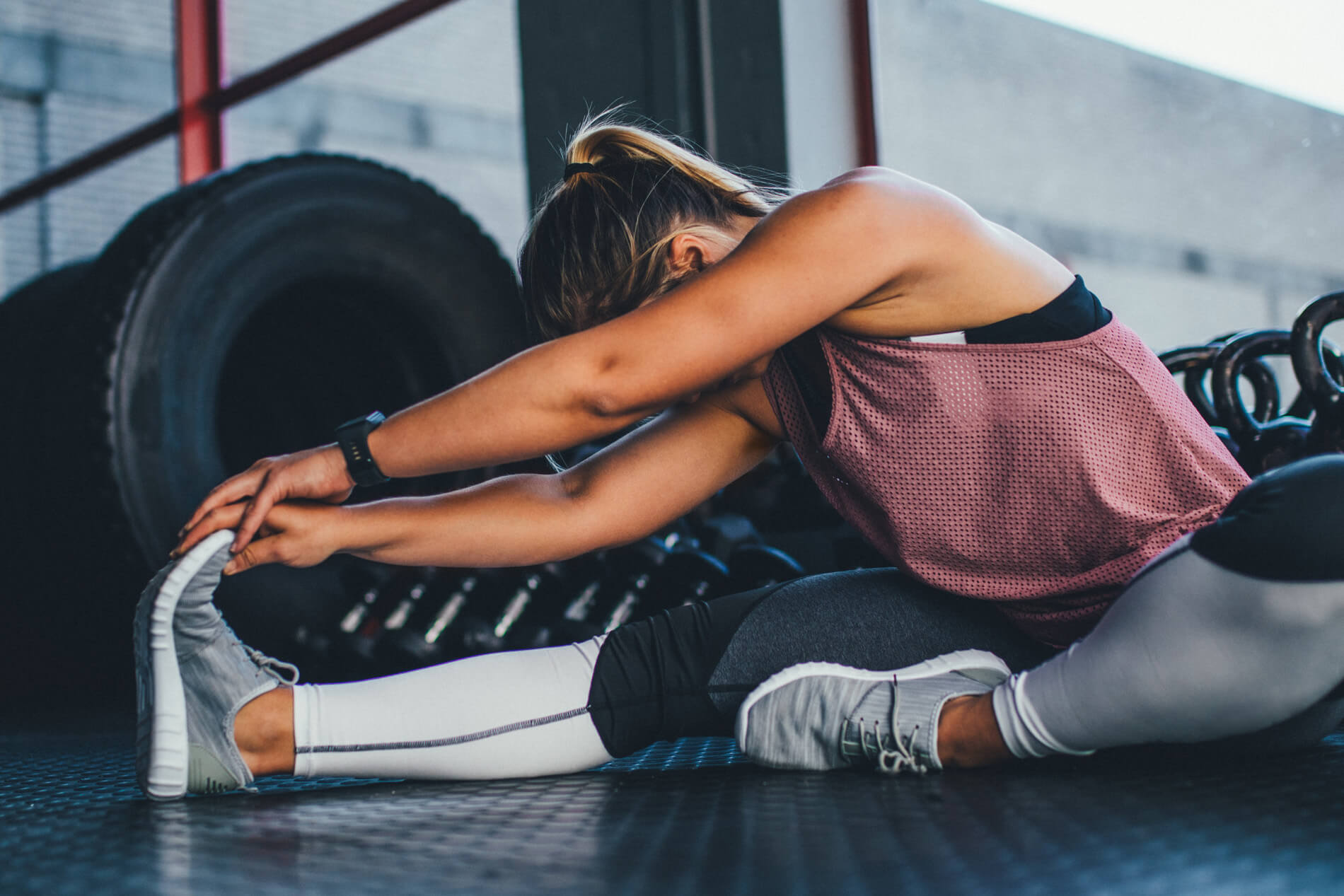 Person stretching in a gym