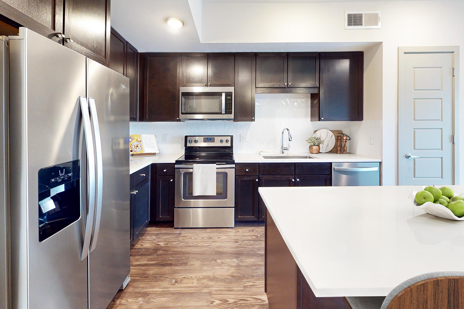 Central Square at Frisco apartment kitchen (virtually staged) - Frisco, TX