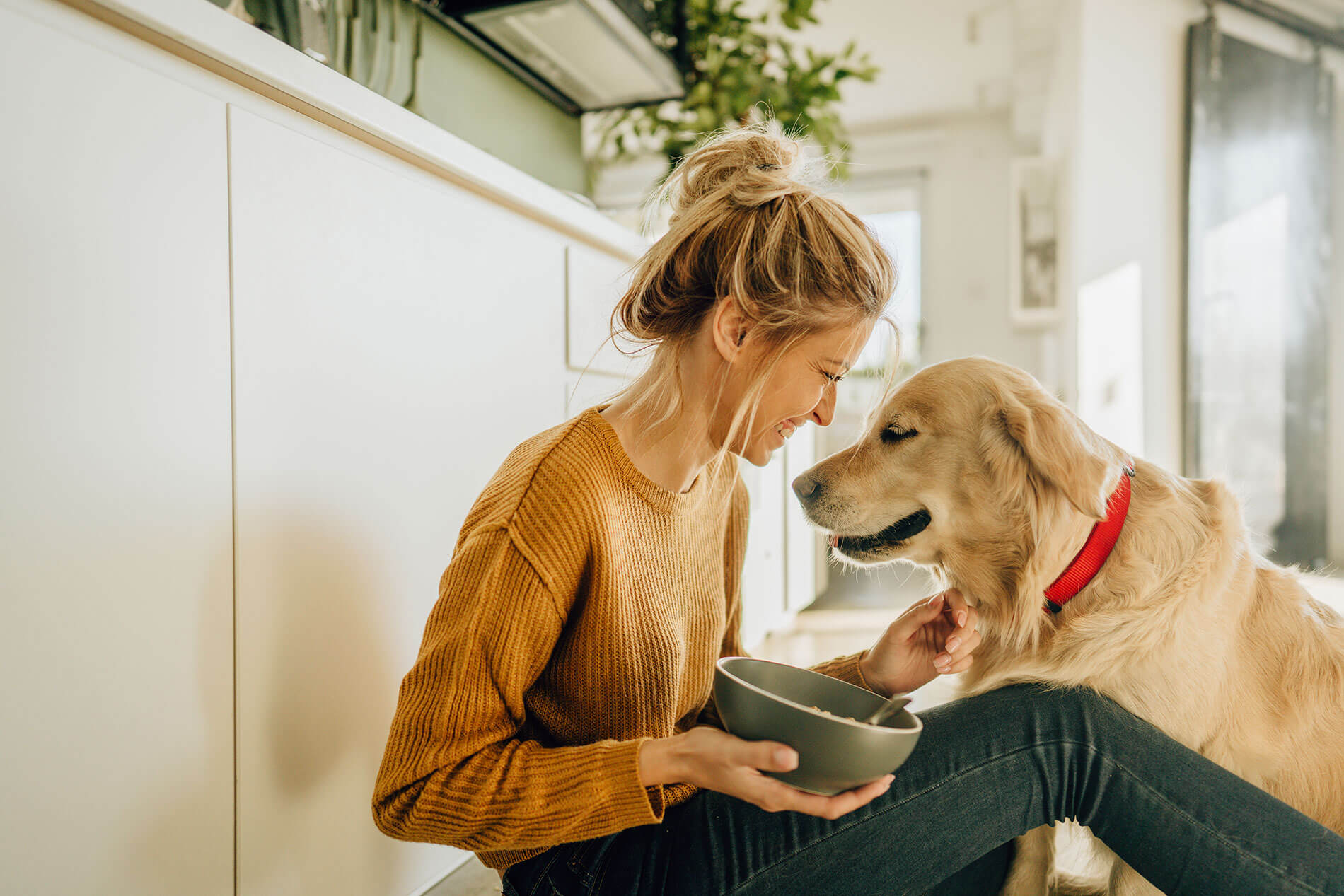 Young woman with happy dog