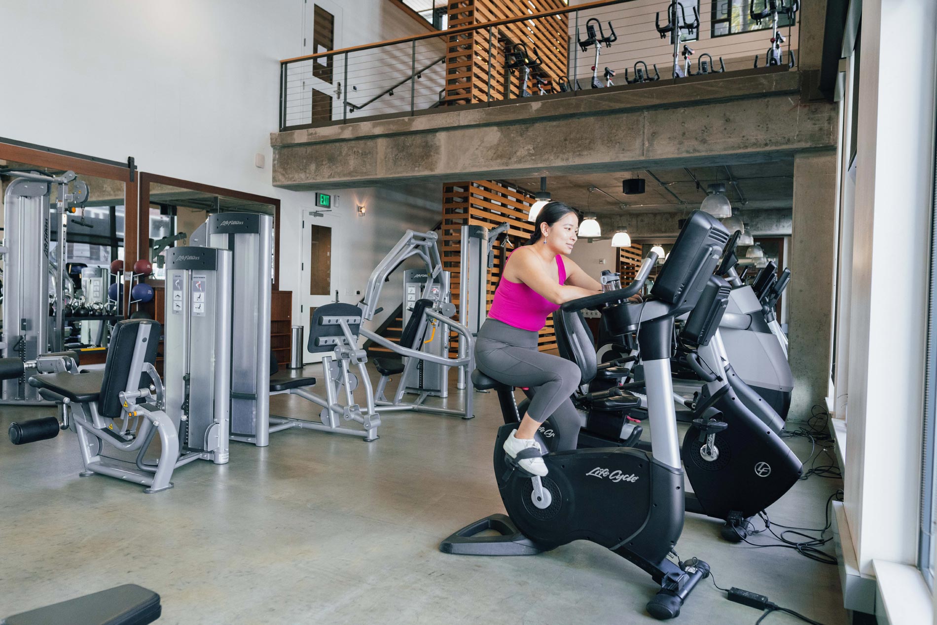 Channel Mission Bay woman working out in fitness center