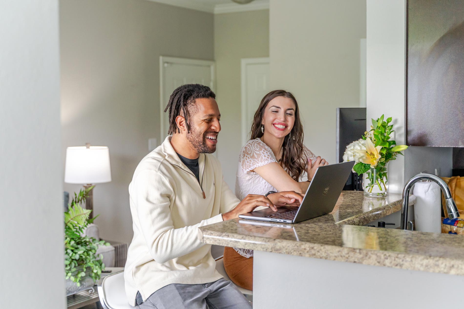 Colonnade woman and man work on kitchen counter