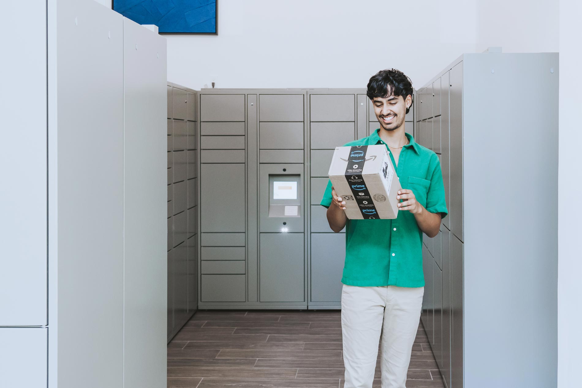 Cool Springs man walks with package from mail room