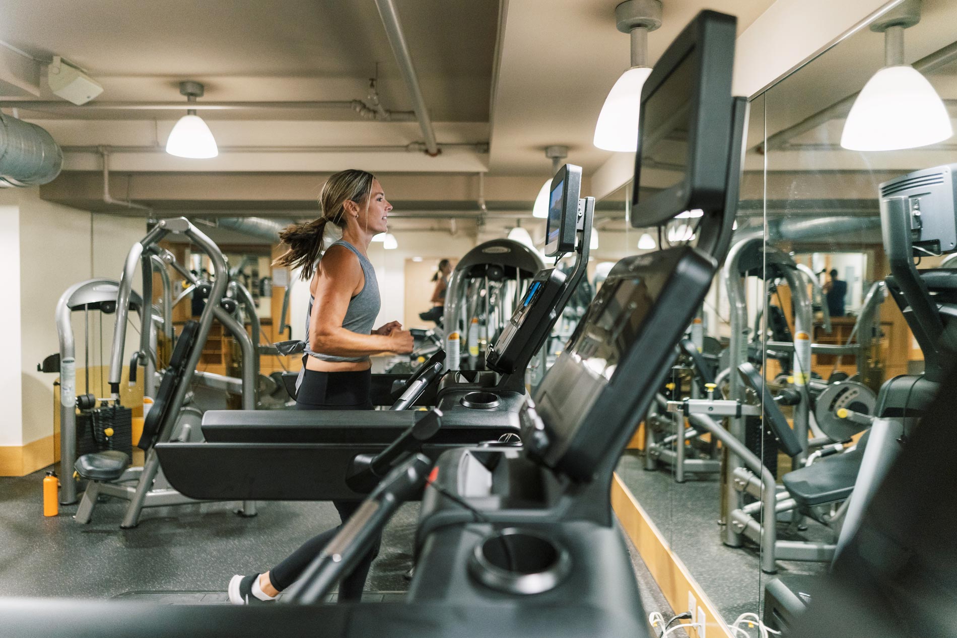 Delancey at Shirlington Village Apartments Woman in Gym