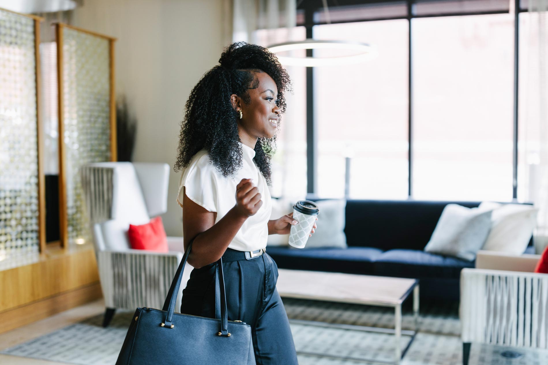 Domain Brewers Hill woman exits lobby with coffee
