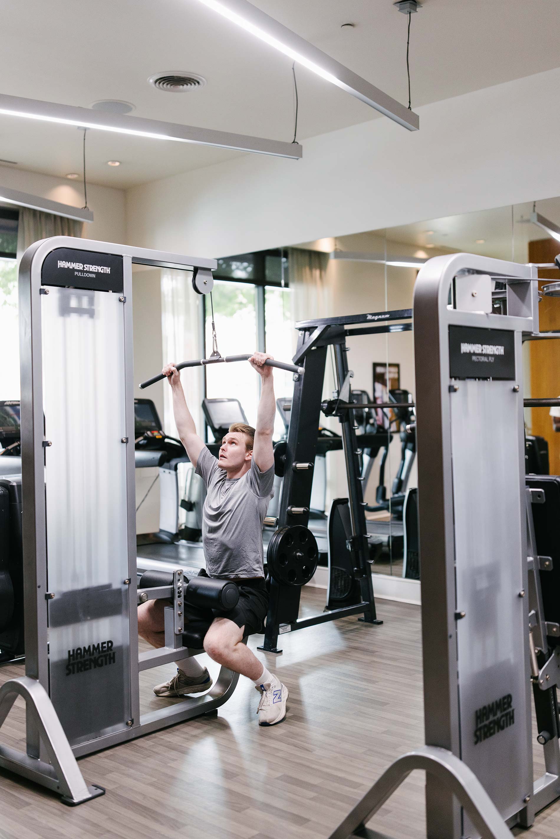 Domain Brewers Hill man exercises in fitness center
