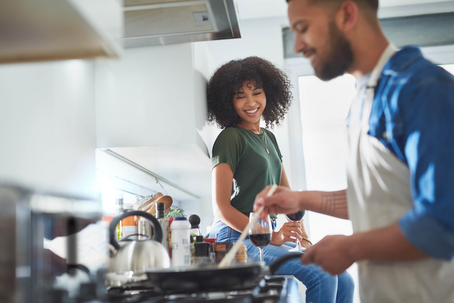 Two people cooking in the kitchen