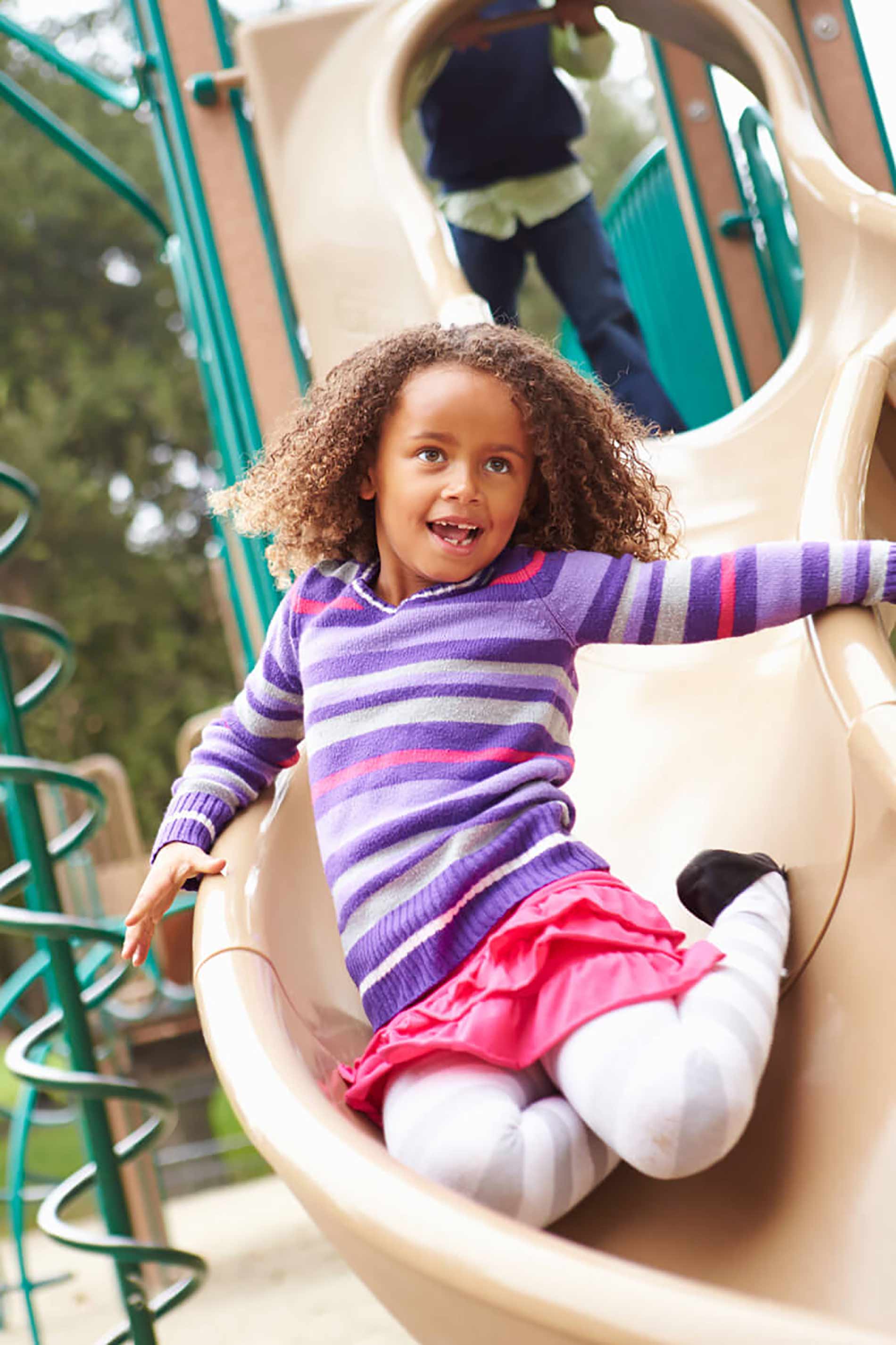 Kid sliding on playground