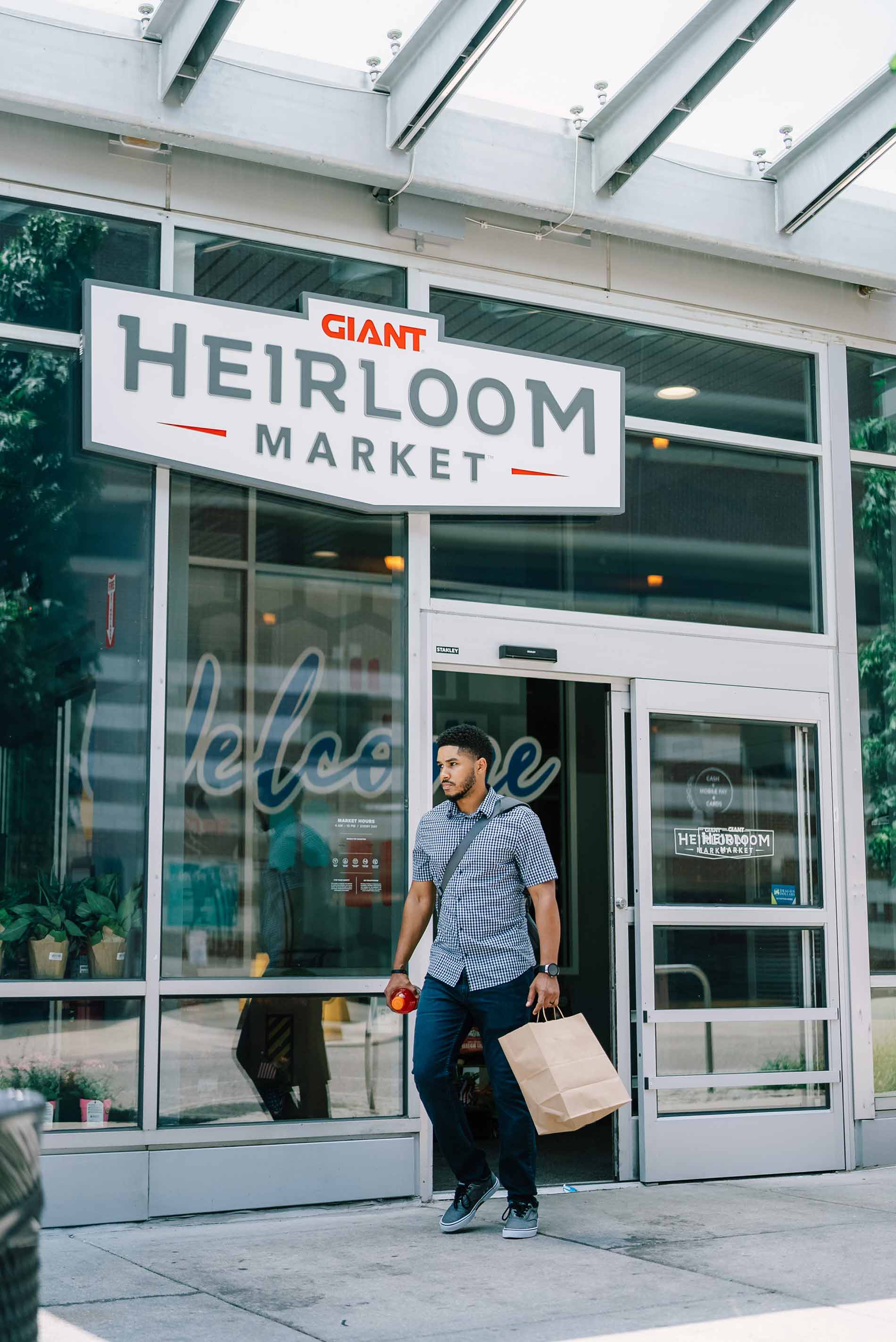 Domus Apartments man walking out of store