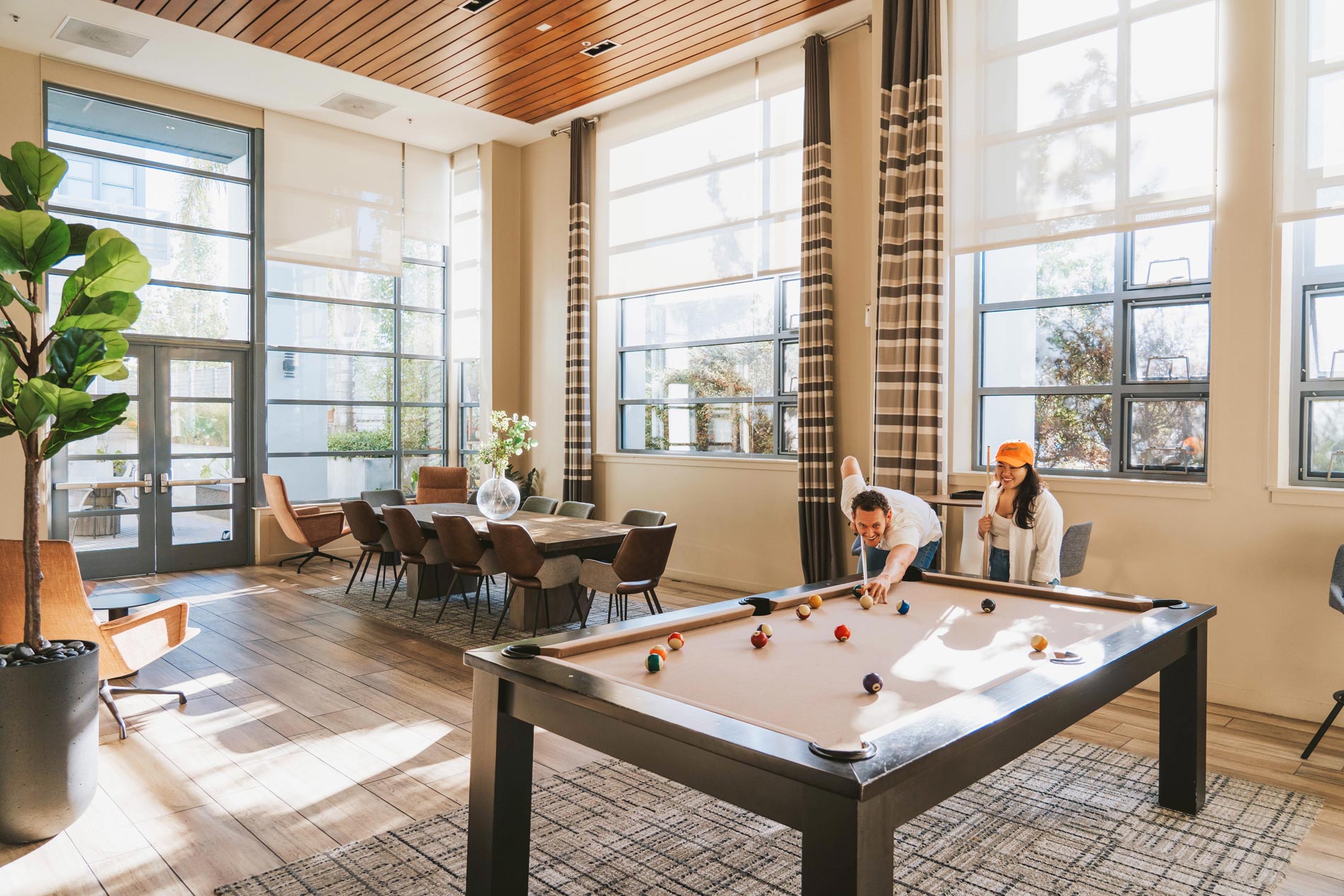 Edgewater three people play pool