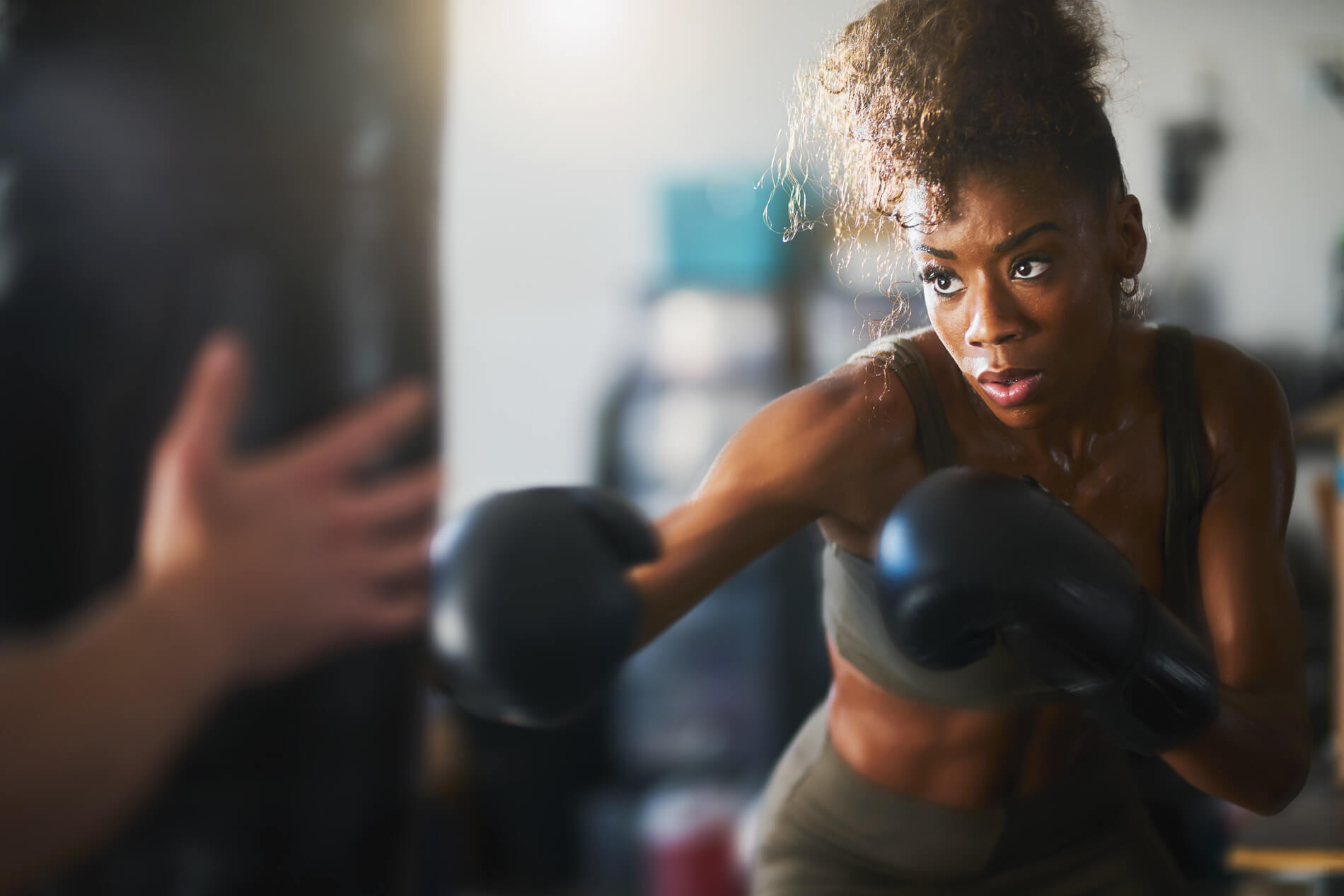 Woman boxing in fitness center