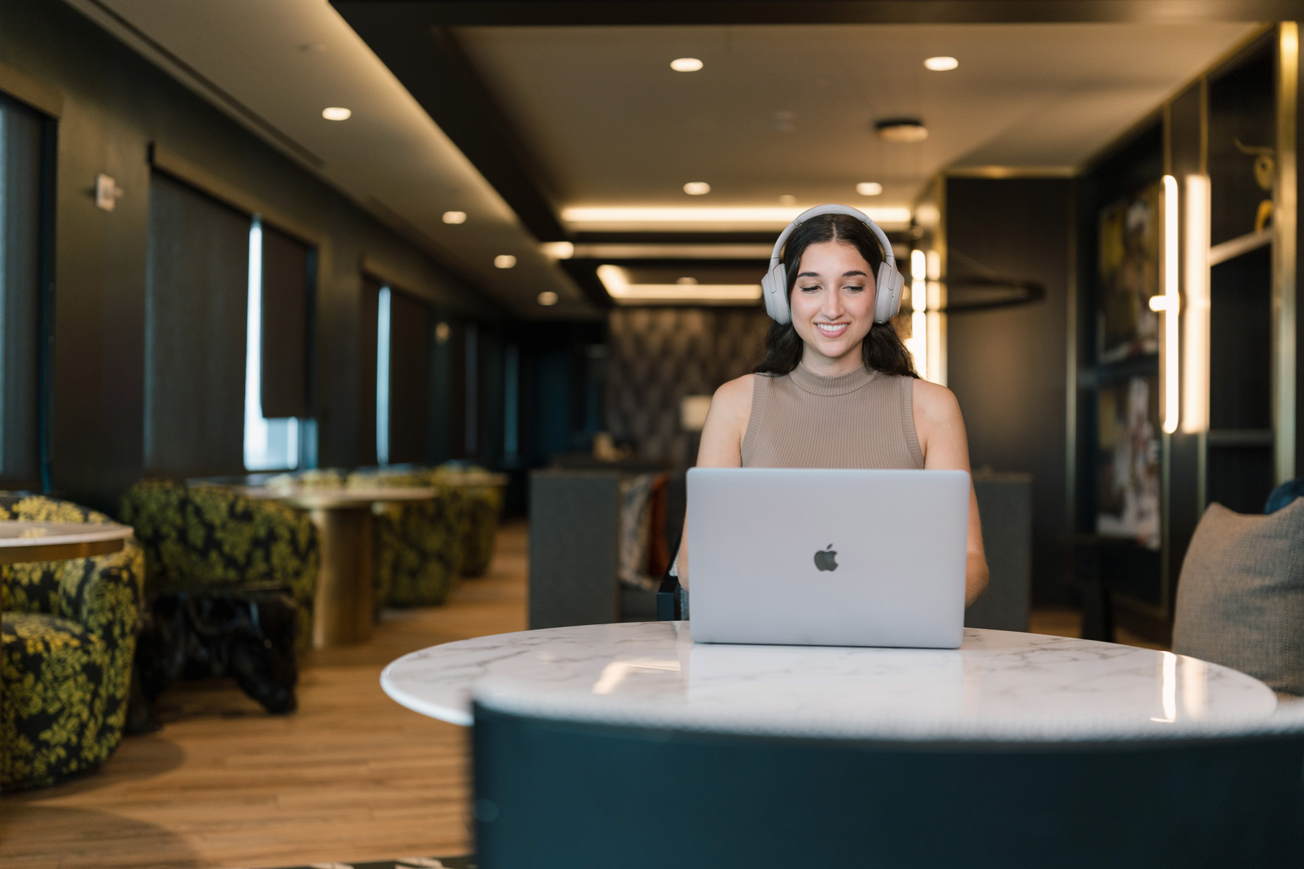 Eleven 55 Woman on laptop in the business center