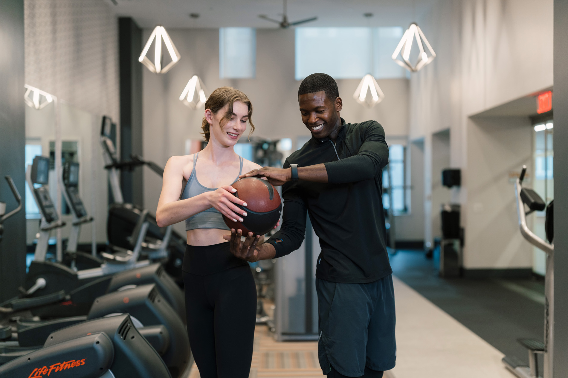 Eleven 55 A woman and man exercise in the fitness center