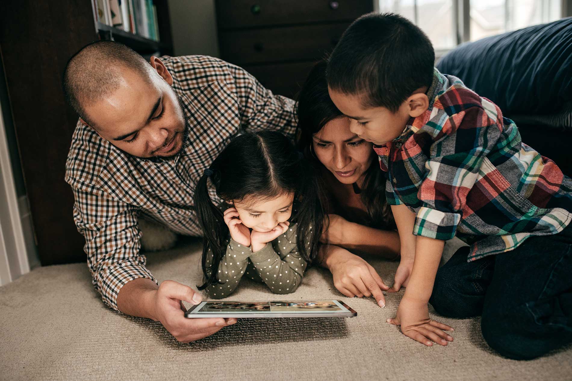 Family looking at tablet