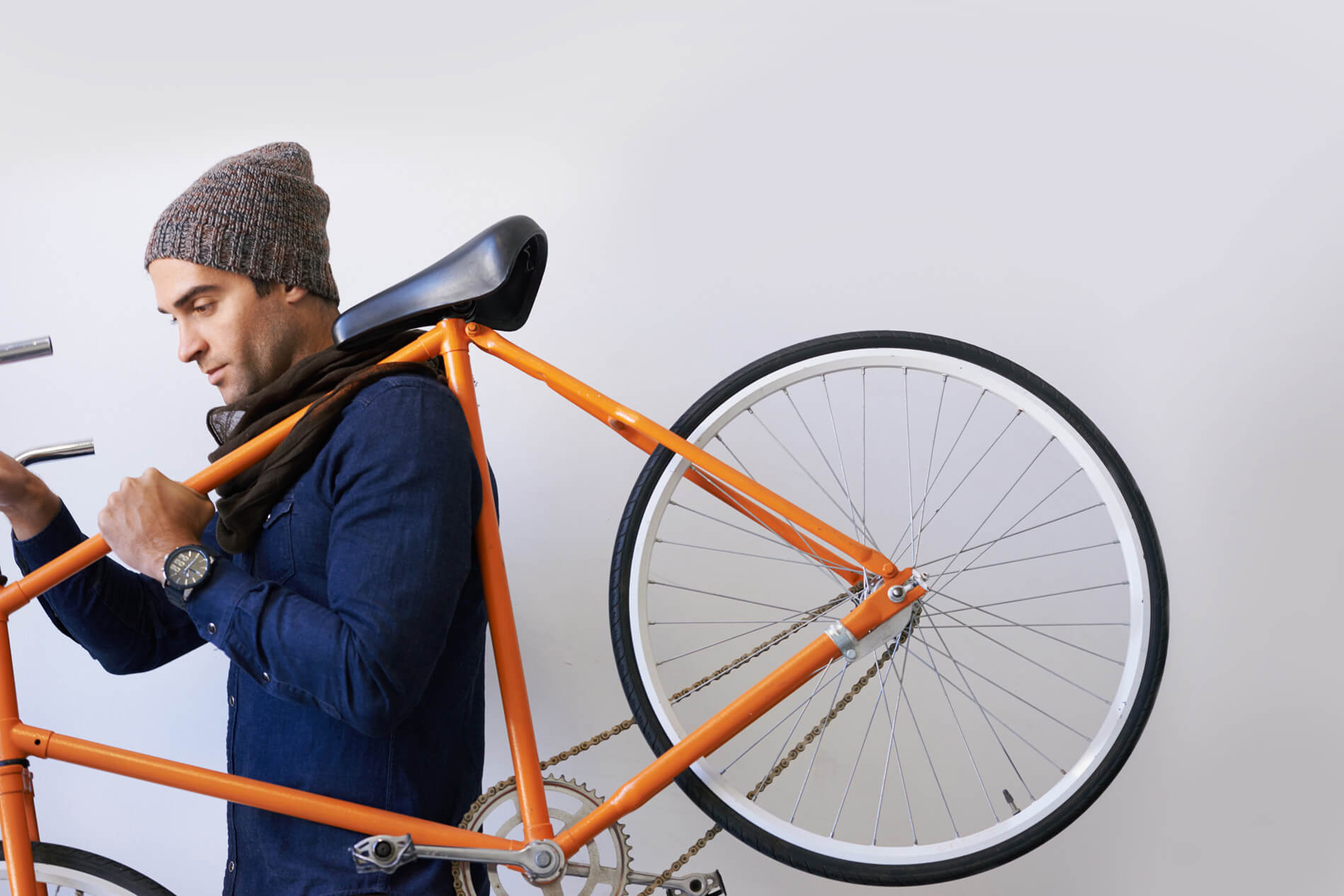 Person carrying a bicycle