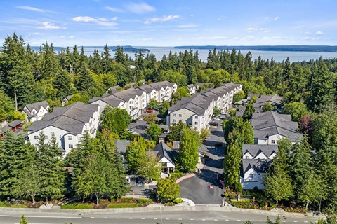 Hearthstone at Merrill Creek apartments located in Everett neighborhood of Seattle features updated interiors, outdoor amenities, and is surrounded by beautiful greenery