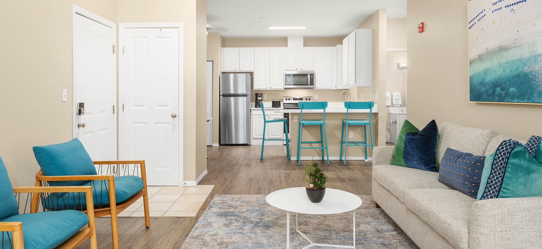 updated interior featuring stainless steel appliances at Hearthstone at Merrill Creek apartments located in the Everett neighborhood of Seattle