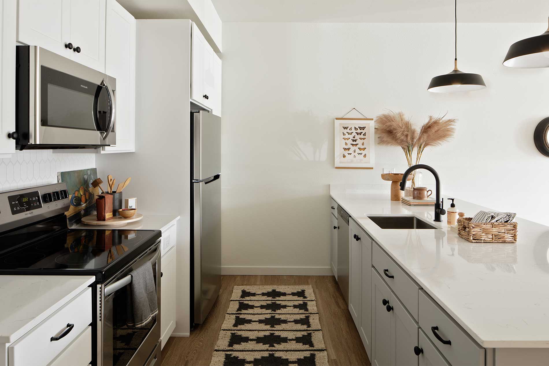 Modern kitchen with white quartz countertops at Heirloom