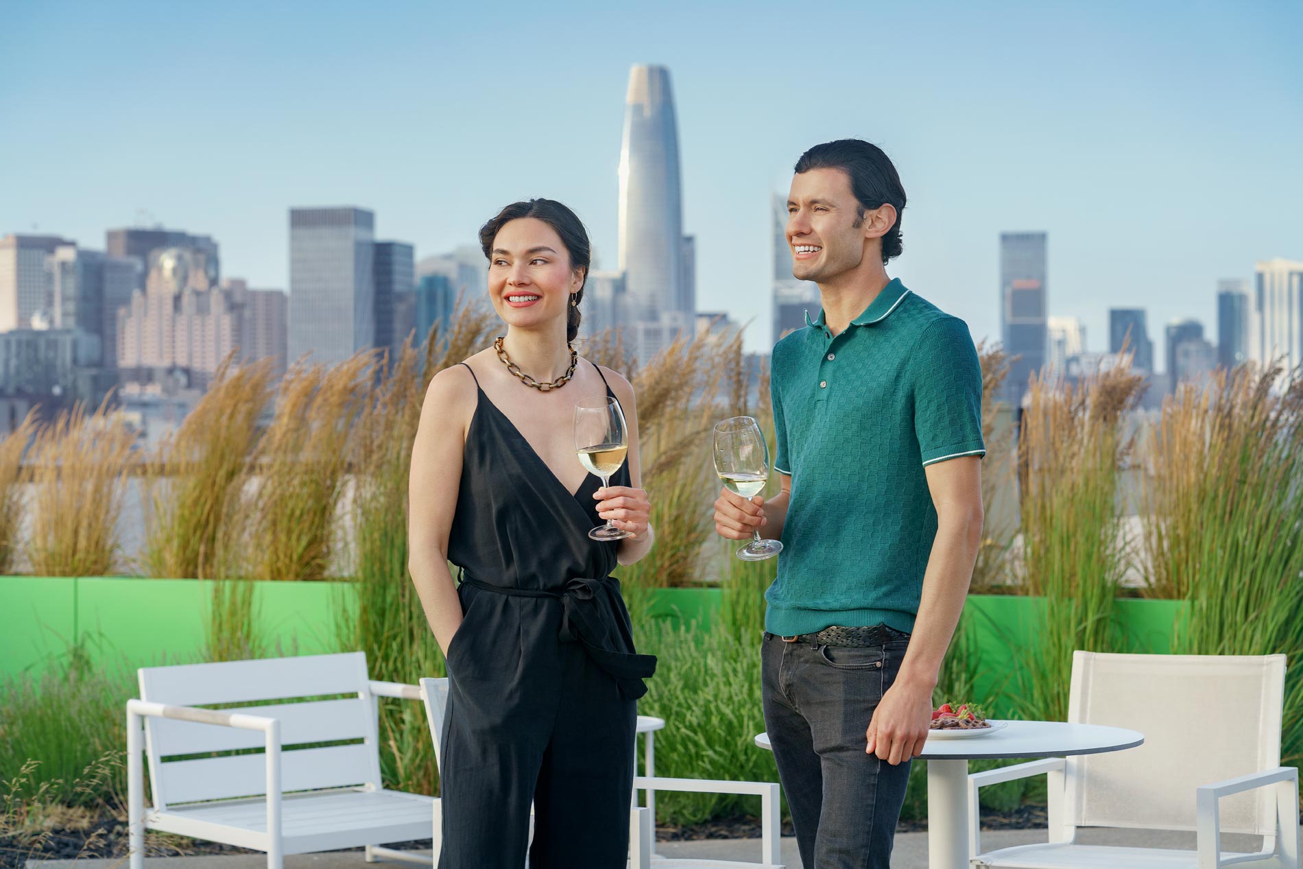 HQ man and woman on rooftop with wine