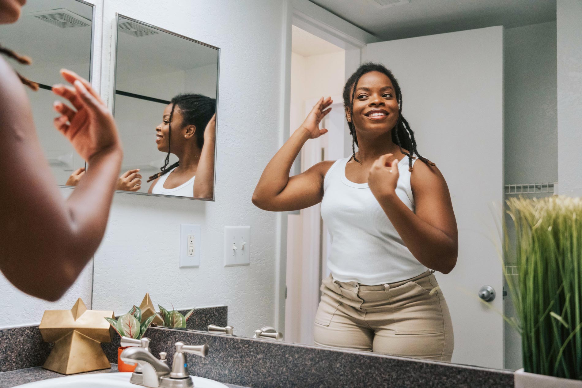 Inlet Bay woman gets ready in bathroom