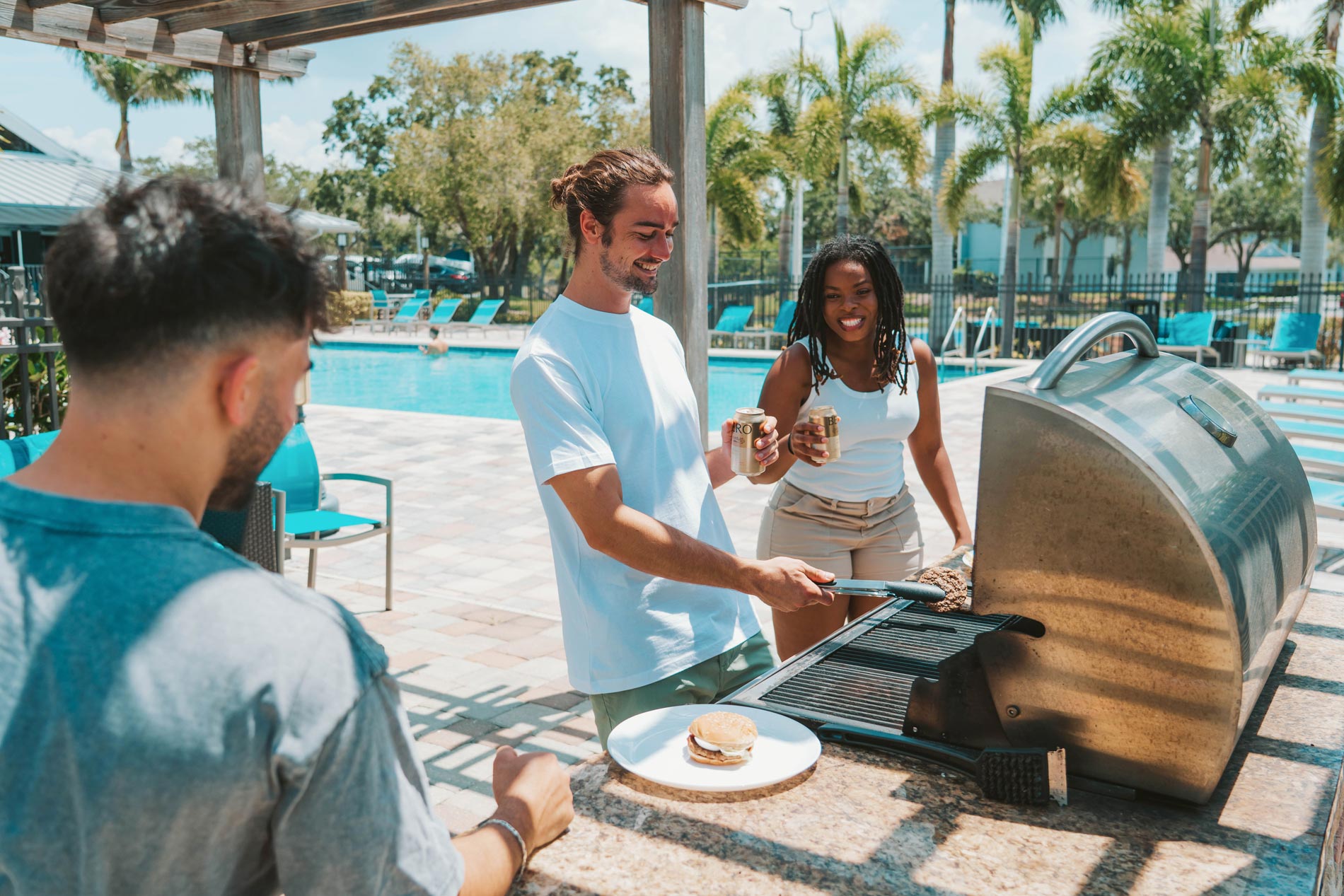 Inlet Bay three people grill in grilling area