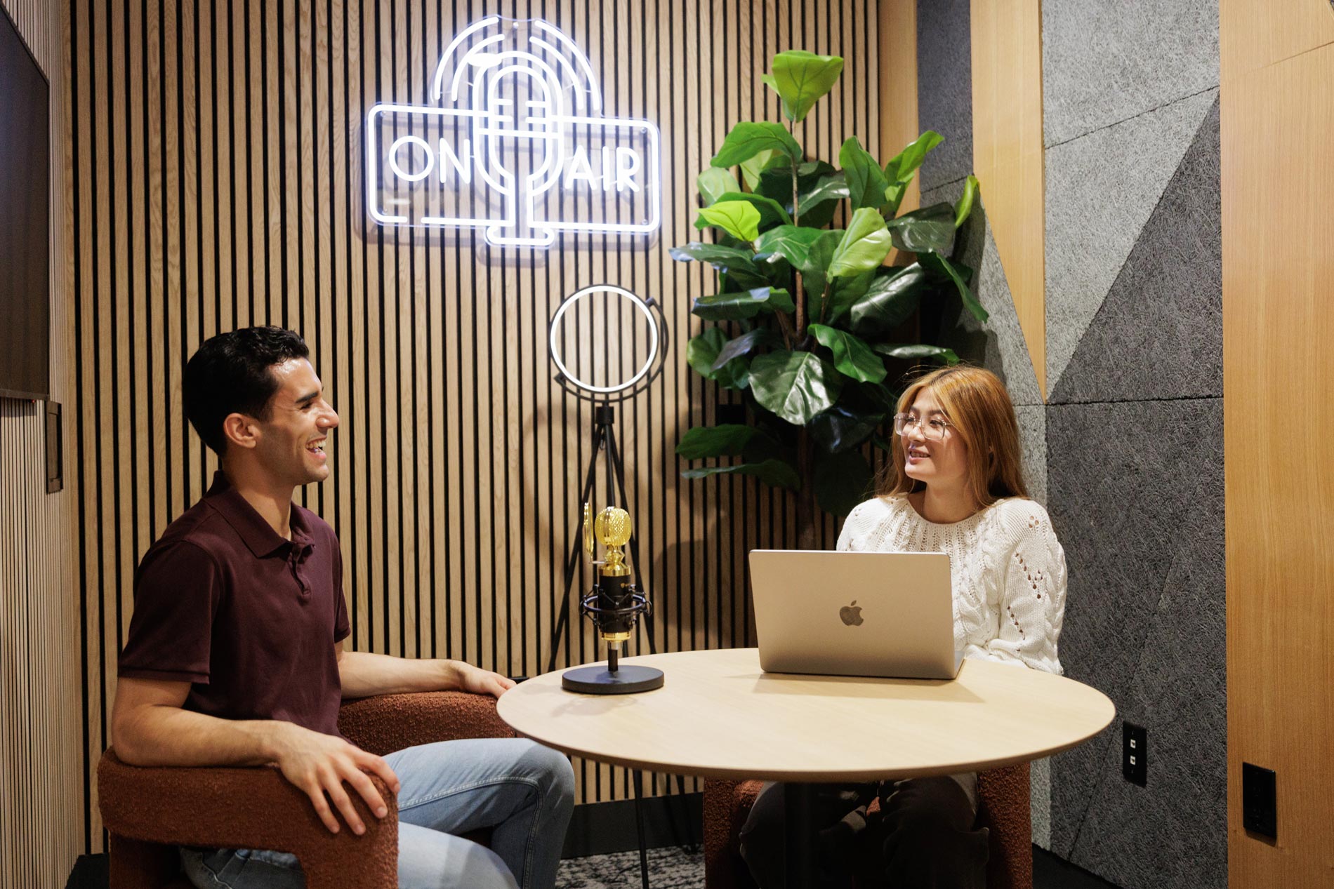 Island Square couple in podcast room