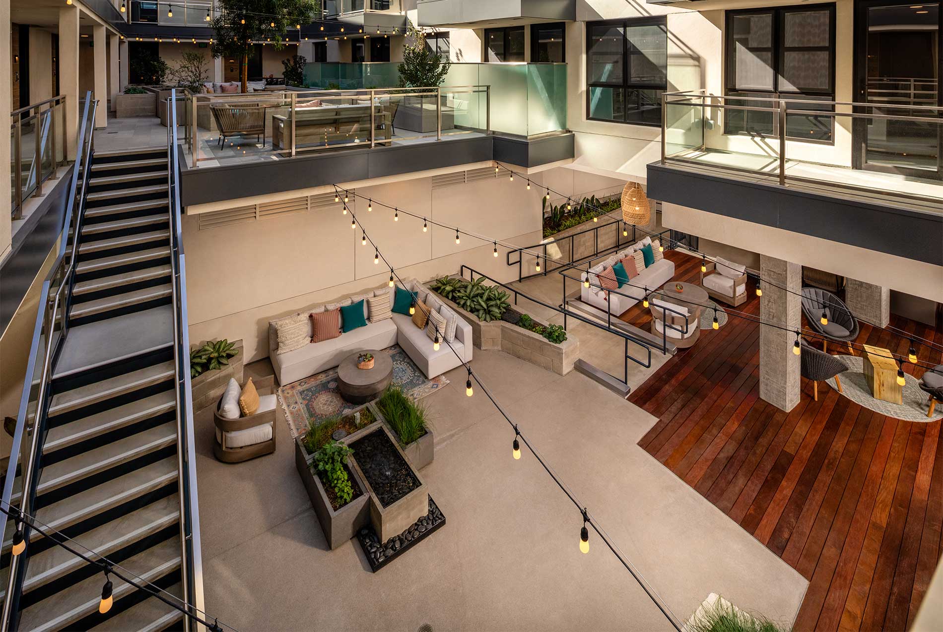 Two-level courtyard with modern seating and landscaped surroundings