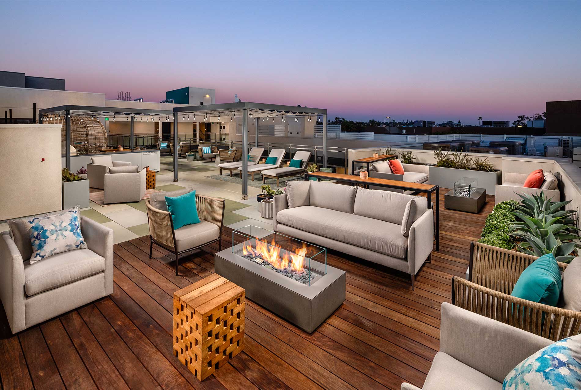 Santa Monica apartment rooftop with gas grills, firepit, and lounge seating